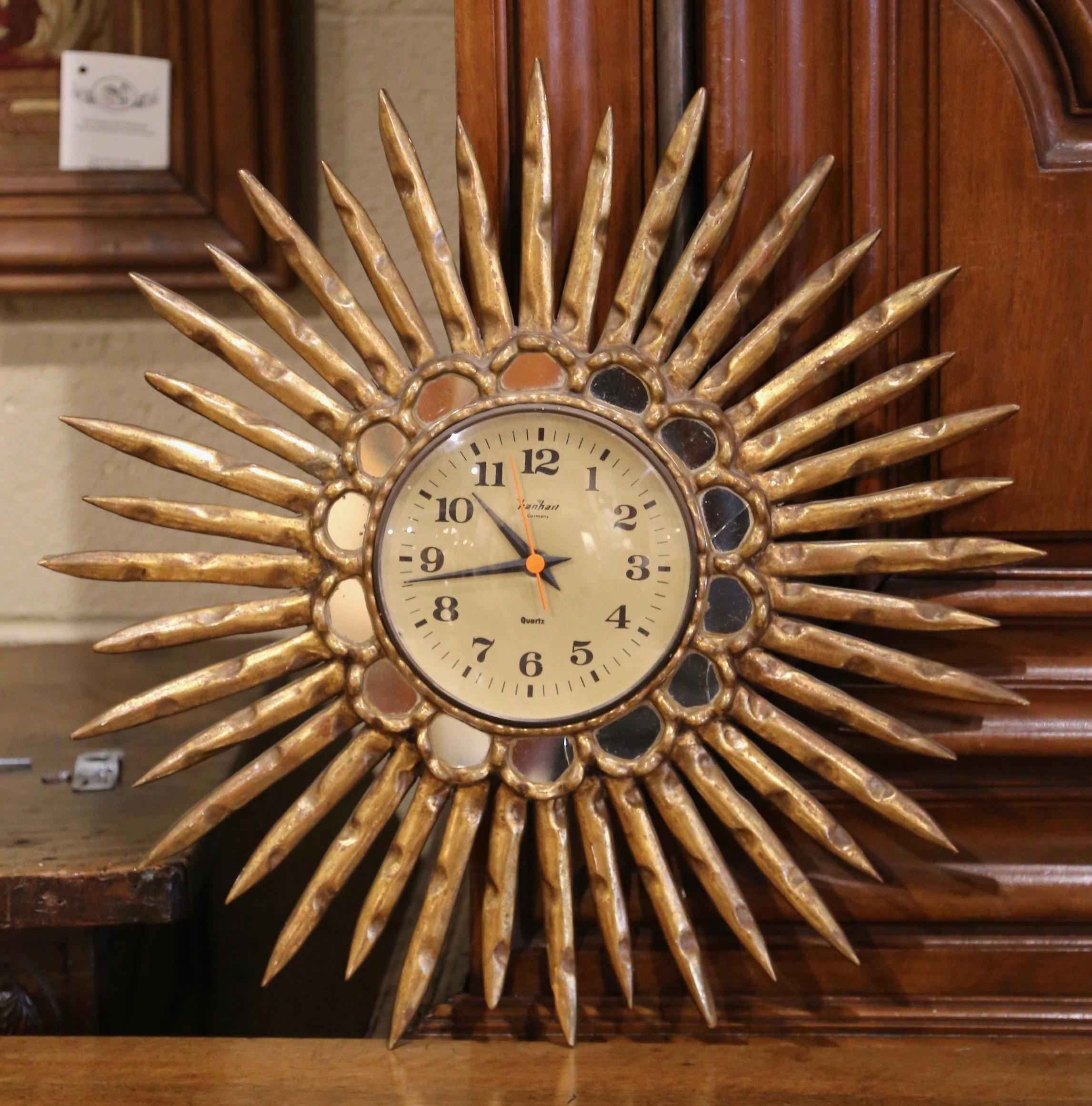 Mid-Century Spanish Carved Giltwood Sunburst Wall Clock with Mirrored Insets In Good Condition For Sale In Dallas, TX