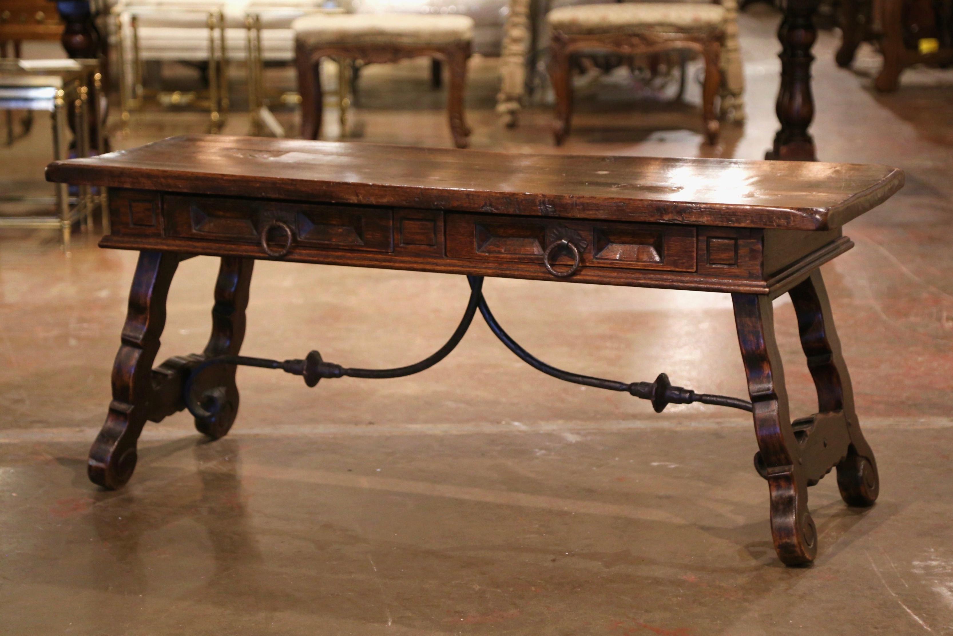 Patinated Mid-Century Spanish Carved Walnut Coffee Table with Iron Stretcher and Drawers