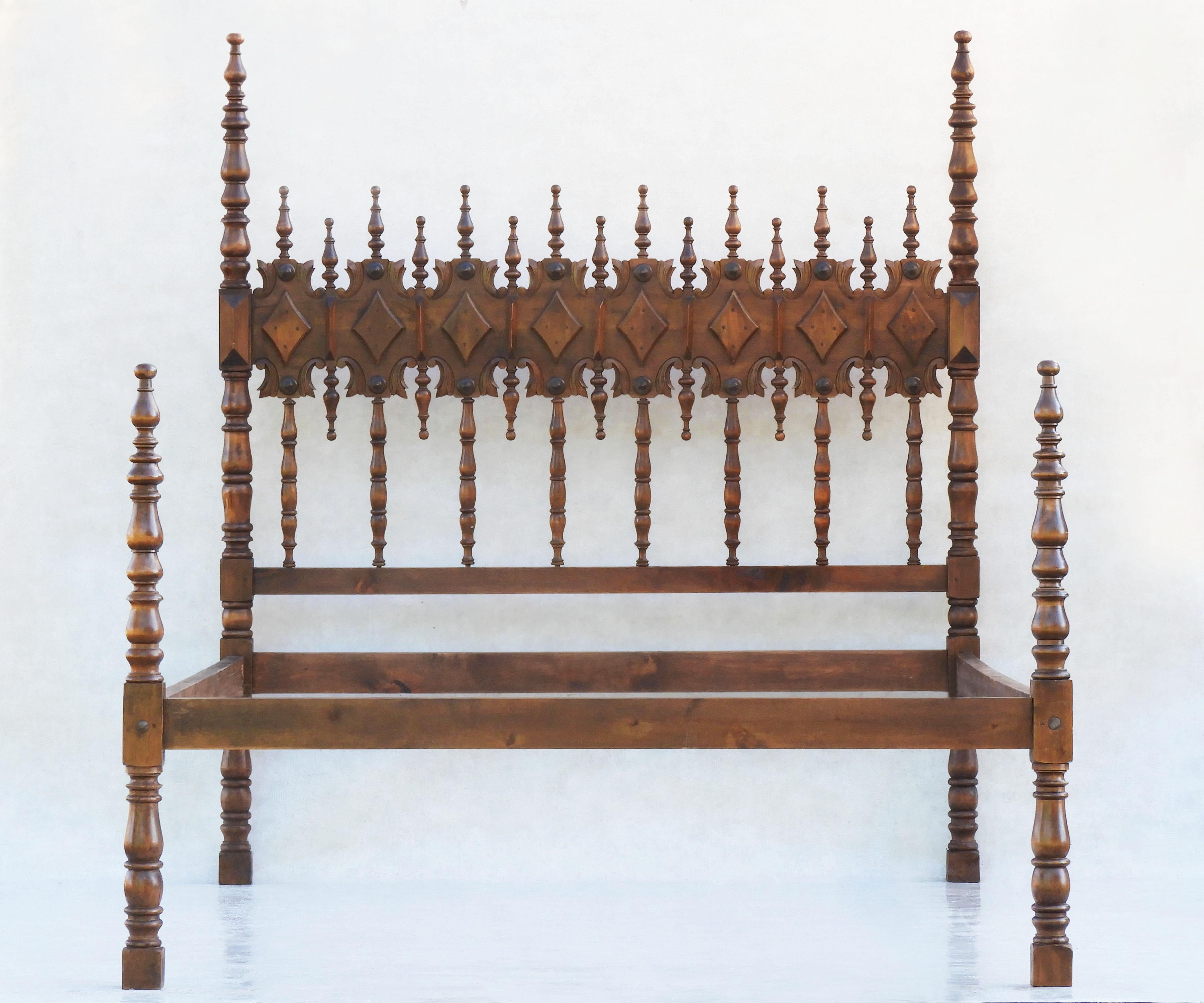 Provincial Spanish four-poster bed with carved medallions and spindle turned wood C1950s

Stunning mid-20th century bed from Toledo in the Castilian region of Spain.
Specially commissioned, Artisan crafted bed, beautifully carved in Fruitwood and