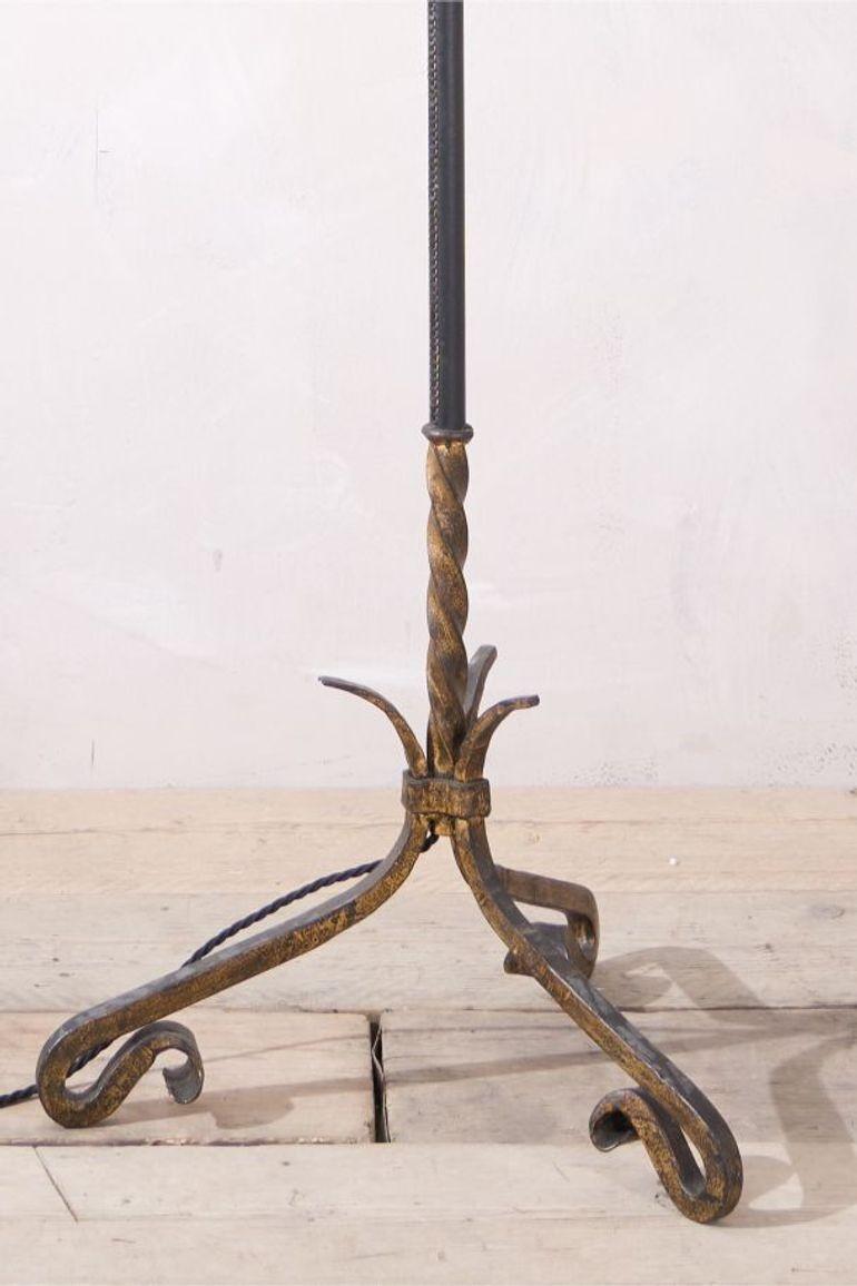 This is a very elegant and unusual Spanish mid century gilt metal and black leather floor lamp. Heavy metal body with a beautifully stitched black leather central detail. Condition overall is very good and will make a great addition to a