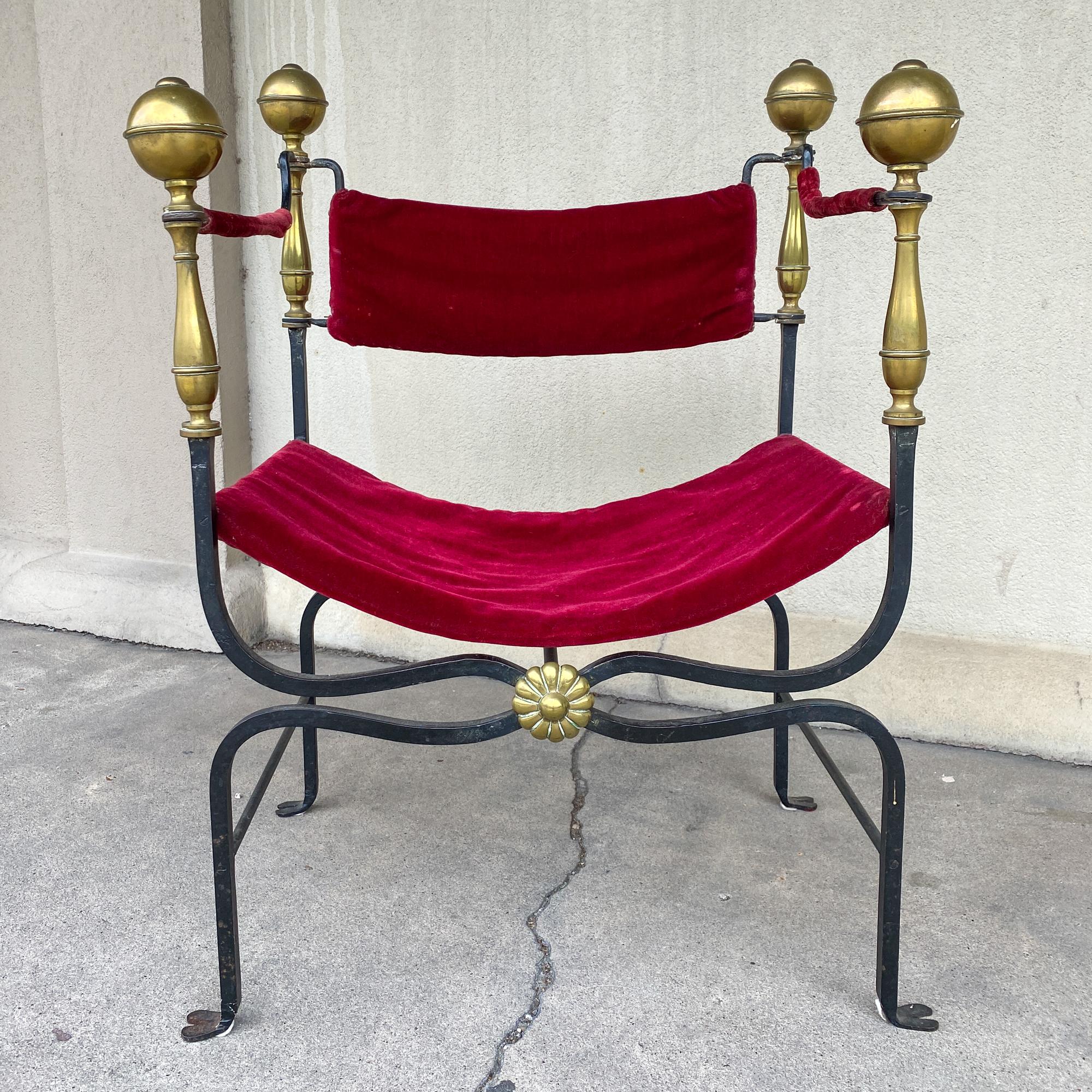 This midcentury Spanish iron Savonarola chair features the classic 