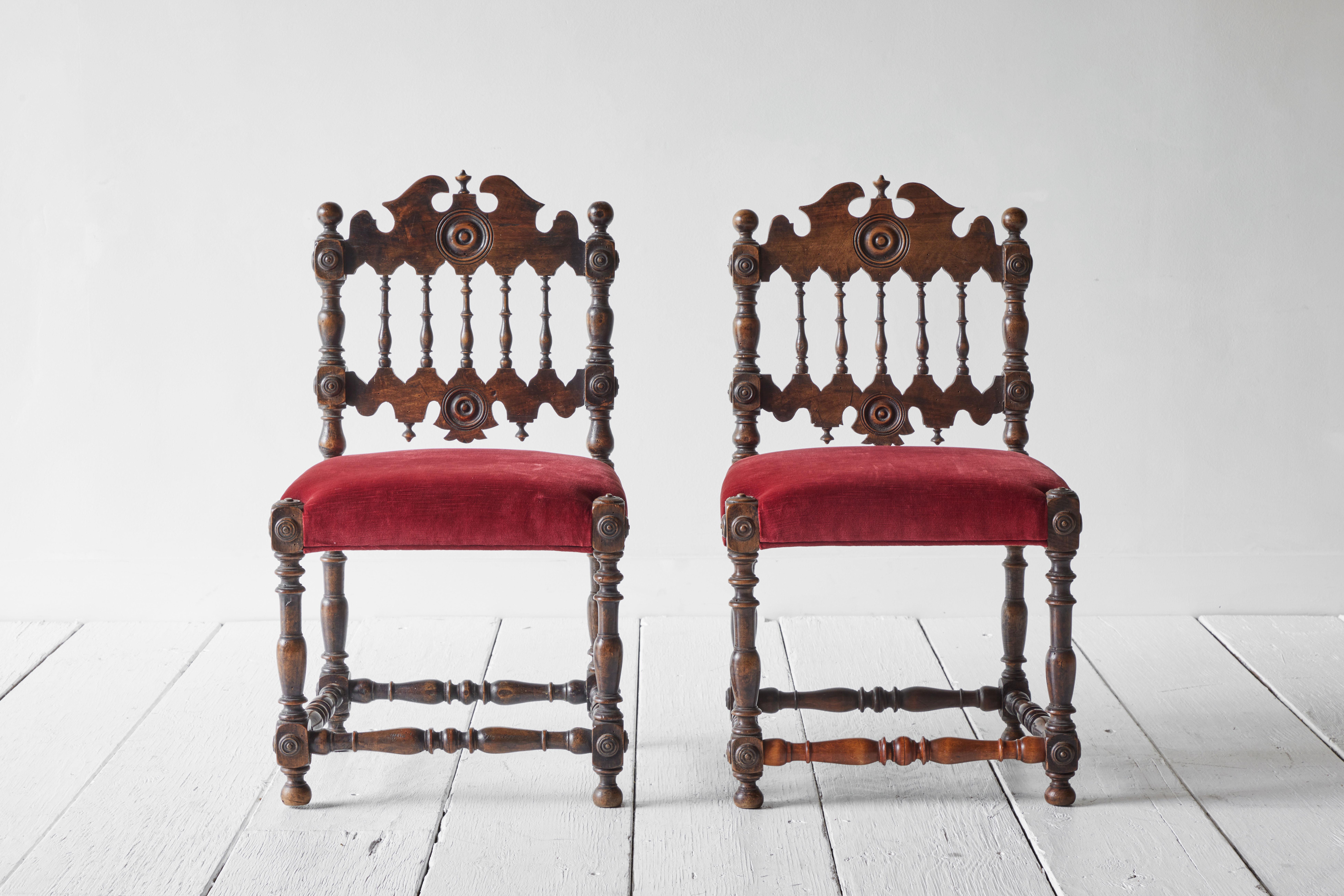 Pair of 1960s Spanish revival chairs with red velvet seats. 
  