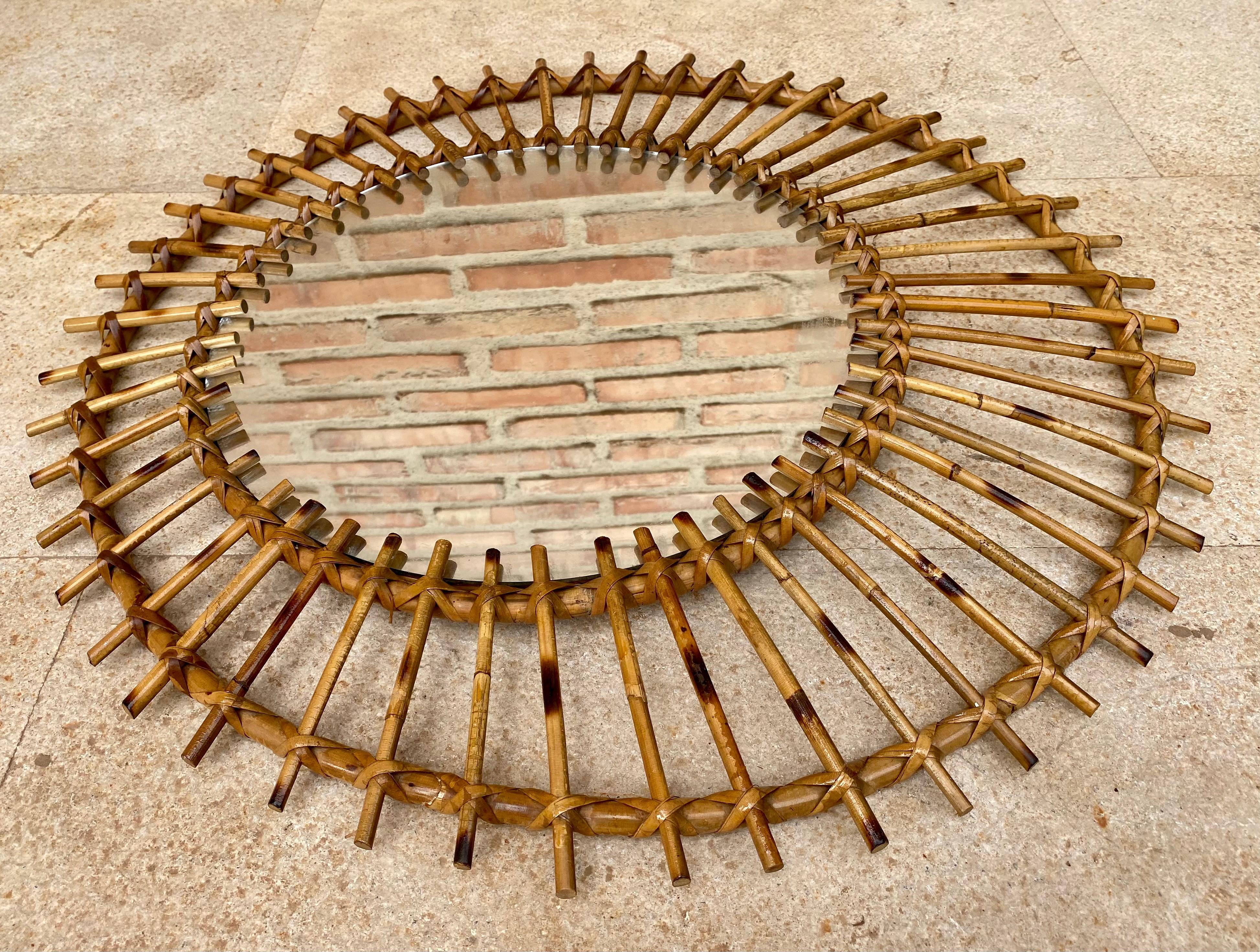 Beautiful Mid-Century Modern Mediterranean Wicker Mirror and Rattan Flower or Sunburst Mirror. Spain, 60s. 
This mirror was handcrafted in Spain in the sixties. It has all the freshness of the Mediterranean flavor and will be a good complement in a