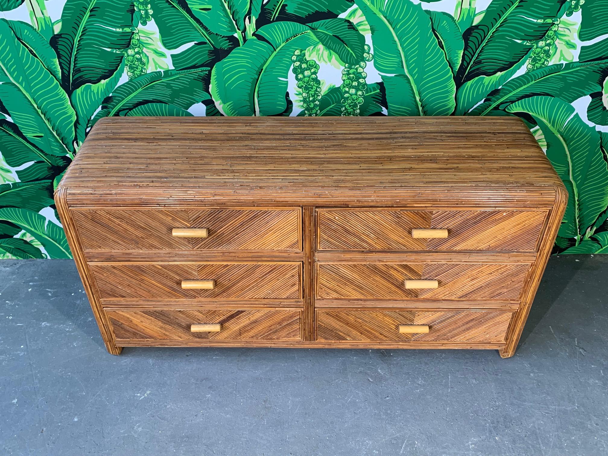 Midcentury dresser veneered in split reed bamboo in a geometric pattern. In the manner of Gabriella Crespi or Willow and Reed. Good vintage condition with minor signs of age. We also have the matching lingerie chest, check our other listings.