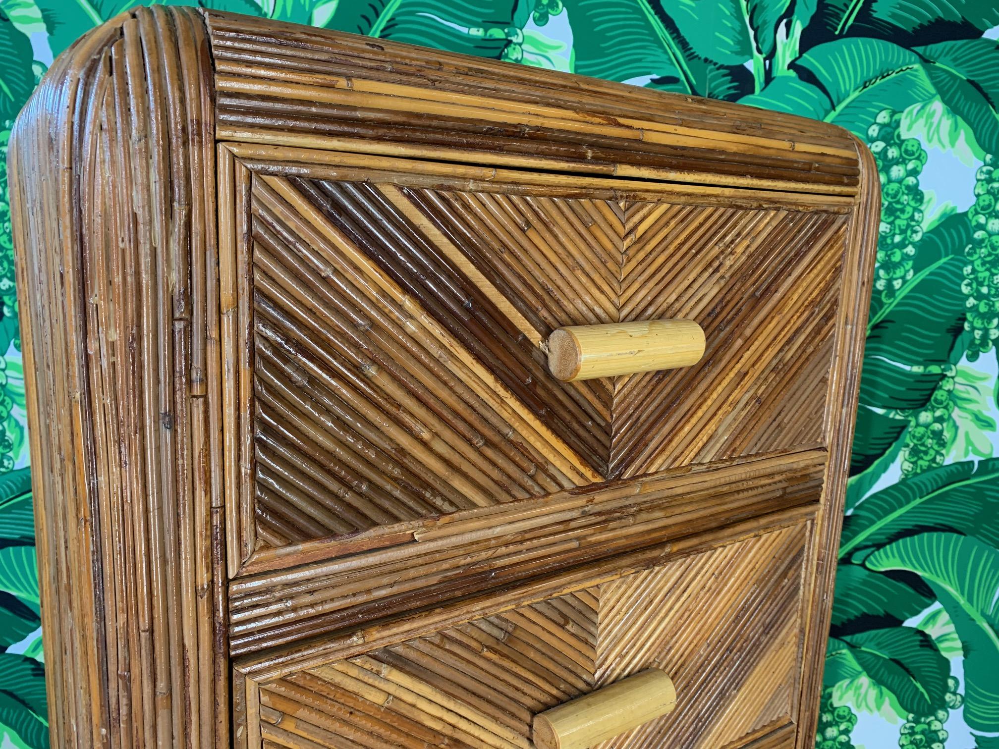 Mid-century lingerie chest veneered in split reed bamboo in a chevron pattern. In the manner of Gabriella Crespi or Willow and Reed. Good vintage condition with minor signs of age. We also have the matching dresser, check our other listings.