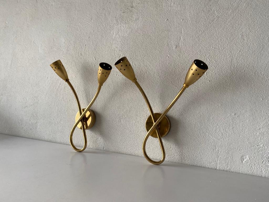 Mid century Sputnik brass pair of sconces, 1950s Italy

Elegant high quality wall lamps.

Lamps are in very good vintage condition.
Wear consistent with age and use

These lamps works with E14 standard light bulbs. 
Wired and suitable to use