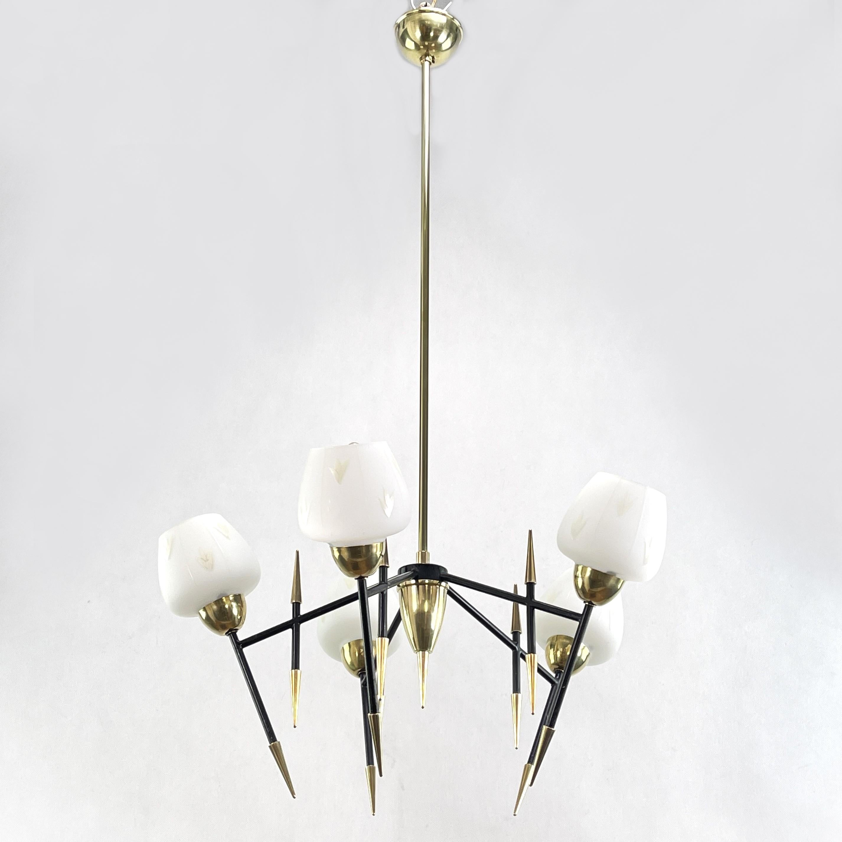 Midcentury ceiling lamp - 1950s

The black, gold and white lamp is a real classic from the 1950s. This chandelier has an extraordinary design and is a highlight for every lounge interior of the Panton-Eames era. It is in the style of the Maison