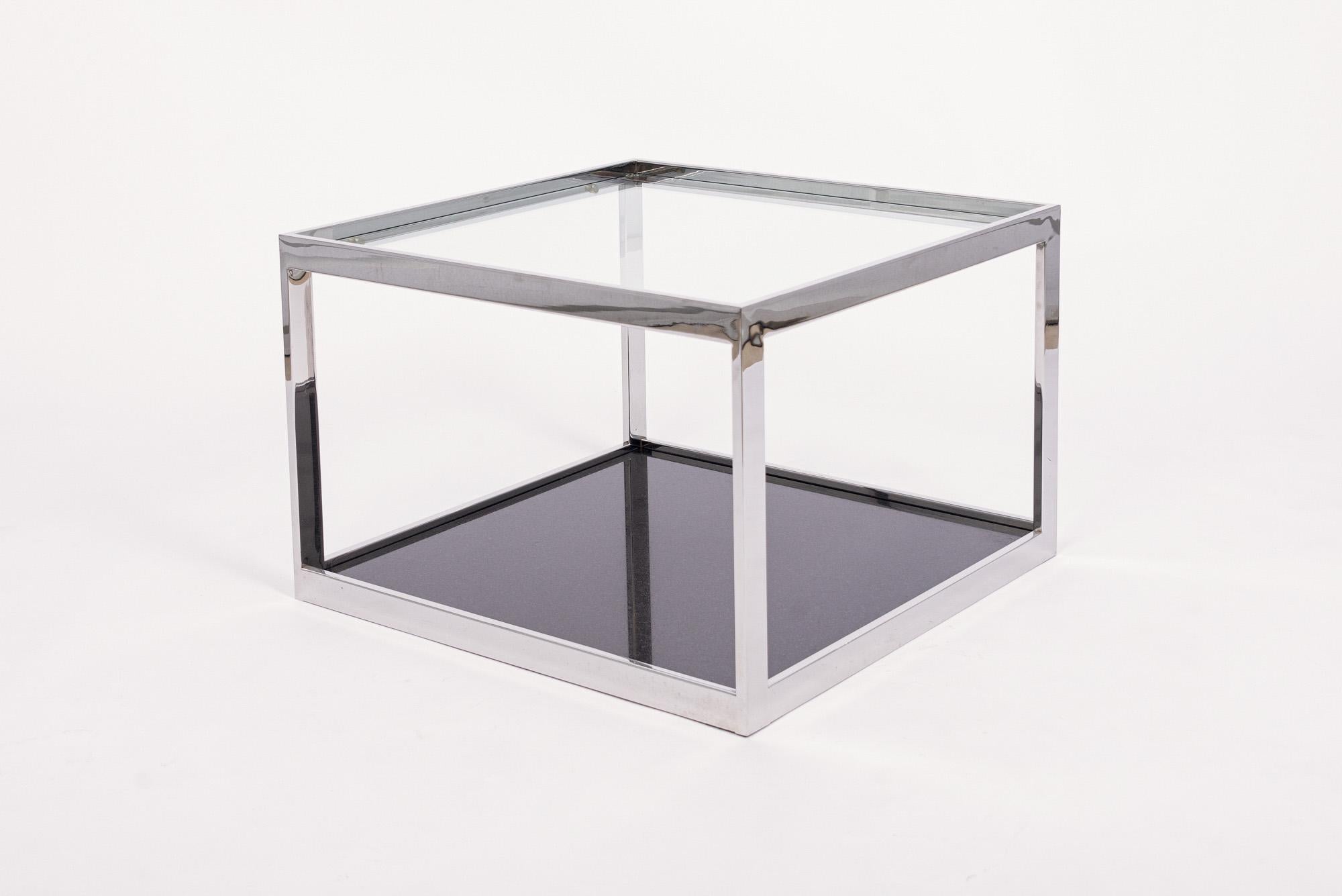 This vintage mid century modern Milo Baughman style side table is circa 1970. The square end table has a clean, minimalist design and features a chrome flat bar frame with a thick glass top and heavy black marble base. Both the glass top and marble