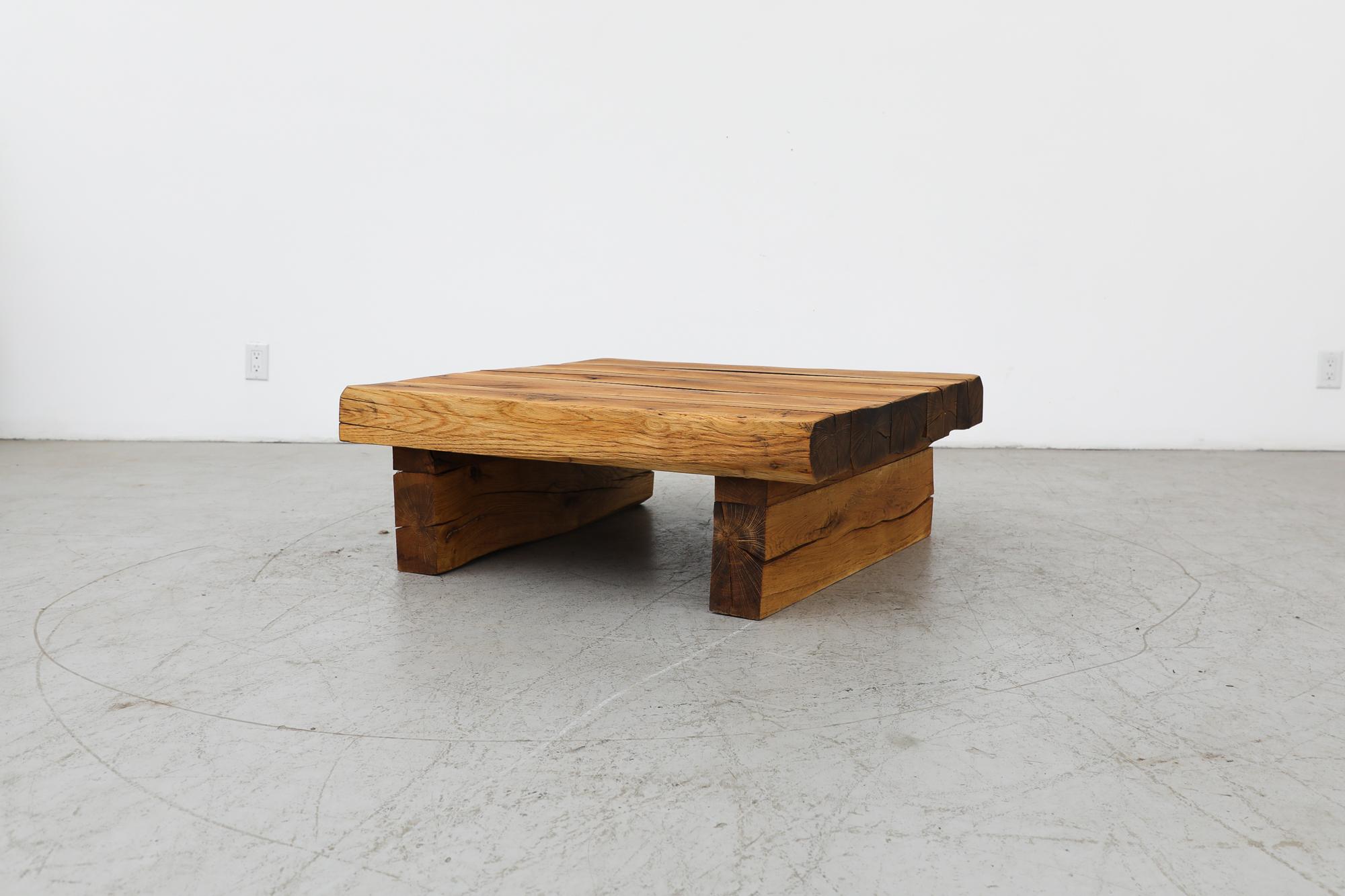Mid-Century, heavy solid oak, square coffee table with clean boxy design and thick rectangular legs. This table is in original condition with visible signs of wear consistent with its age and use.