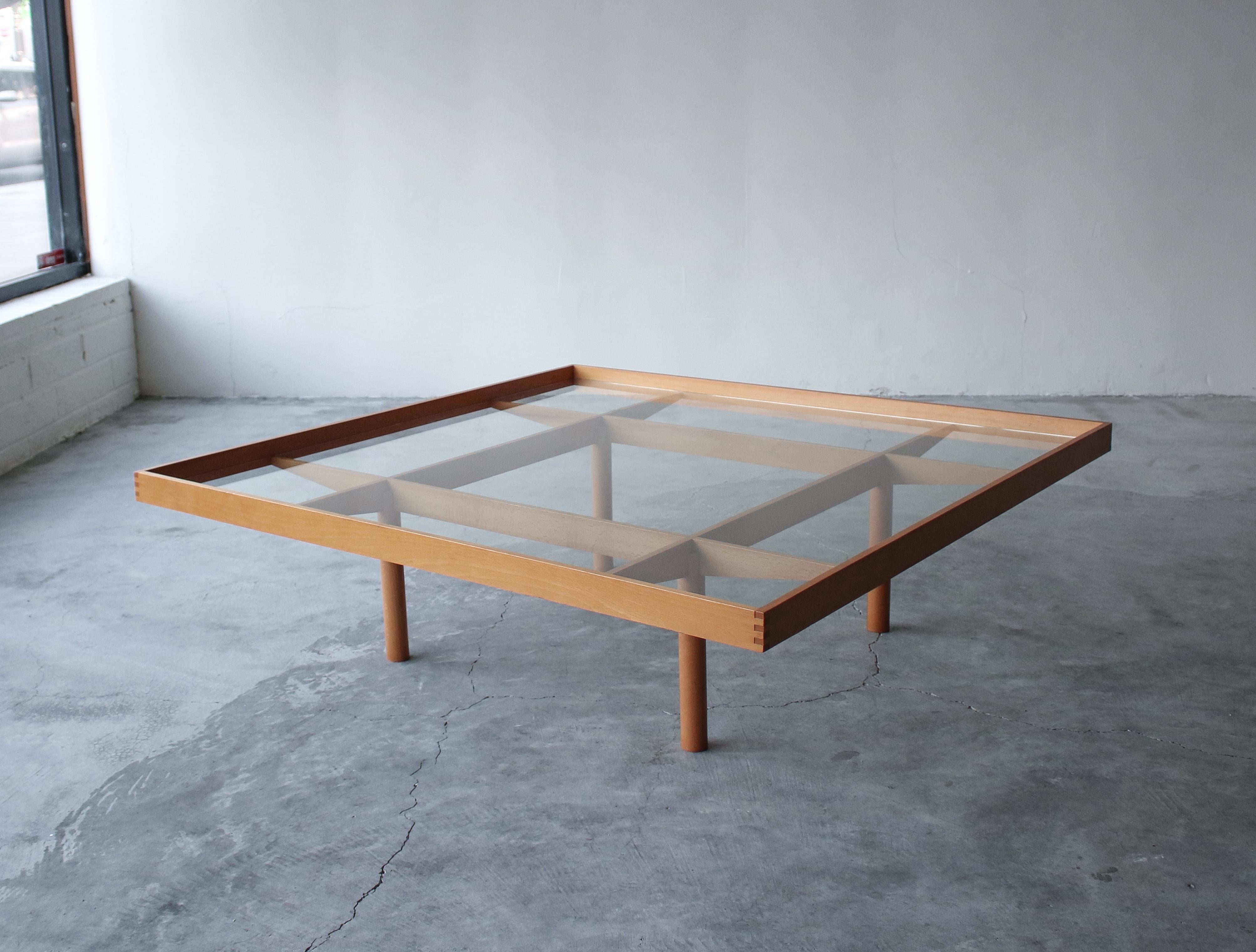 A coffee table like no other. The architectural details on this gorgeously crafted Italian coffee table are stunning. Constructed of maple and glass, there are dovetails at every corner and angle cut cross bars that form a tic tac toe like grid of