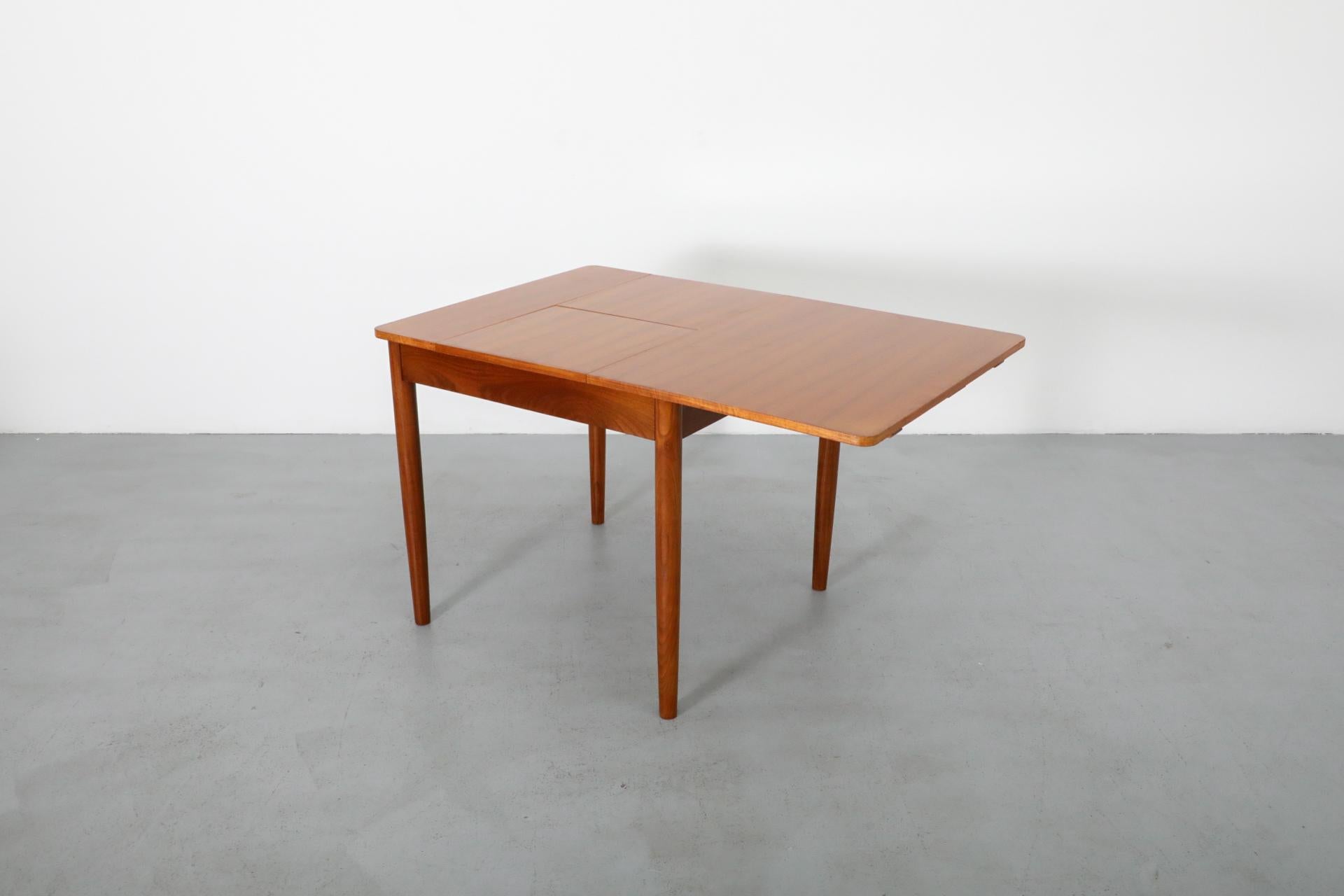 Mid-Century Square Teak Dining Table with Party Leaf and Tapered Legs In Good Condition In Los Angeles, CA