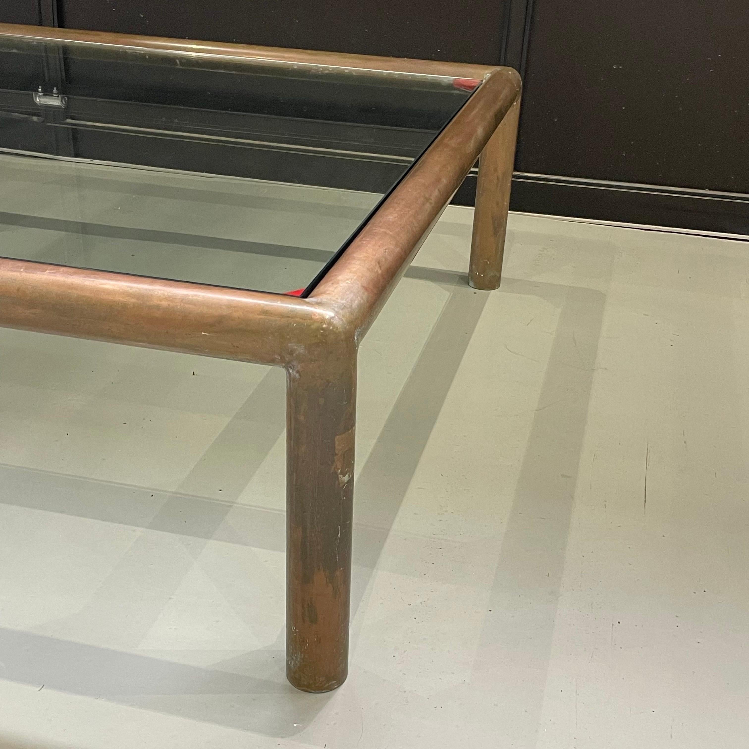 Large scale Mid Century square tubular brass coffee table with new glass top.  Beautiful patina in the brass base.