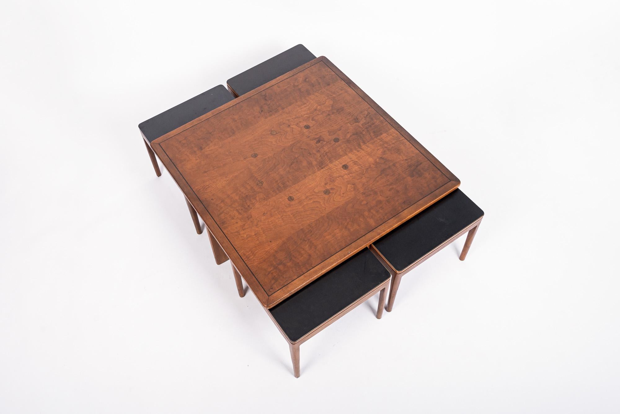 This vintage mid century modern square wooden coffee table with four end tables was designed by Kipp Stewart for Drexel and produced in 1960. The table has classic Danish modern design with clean, minimalist, geometric lines and beautiful