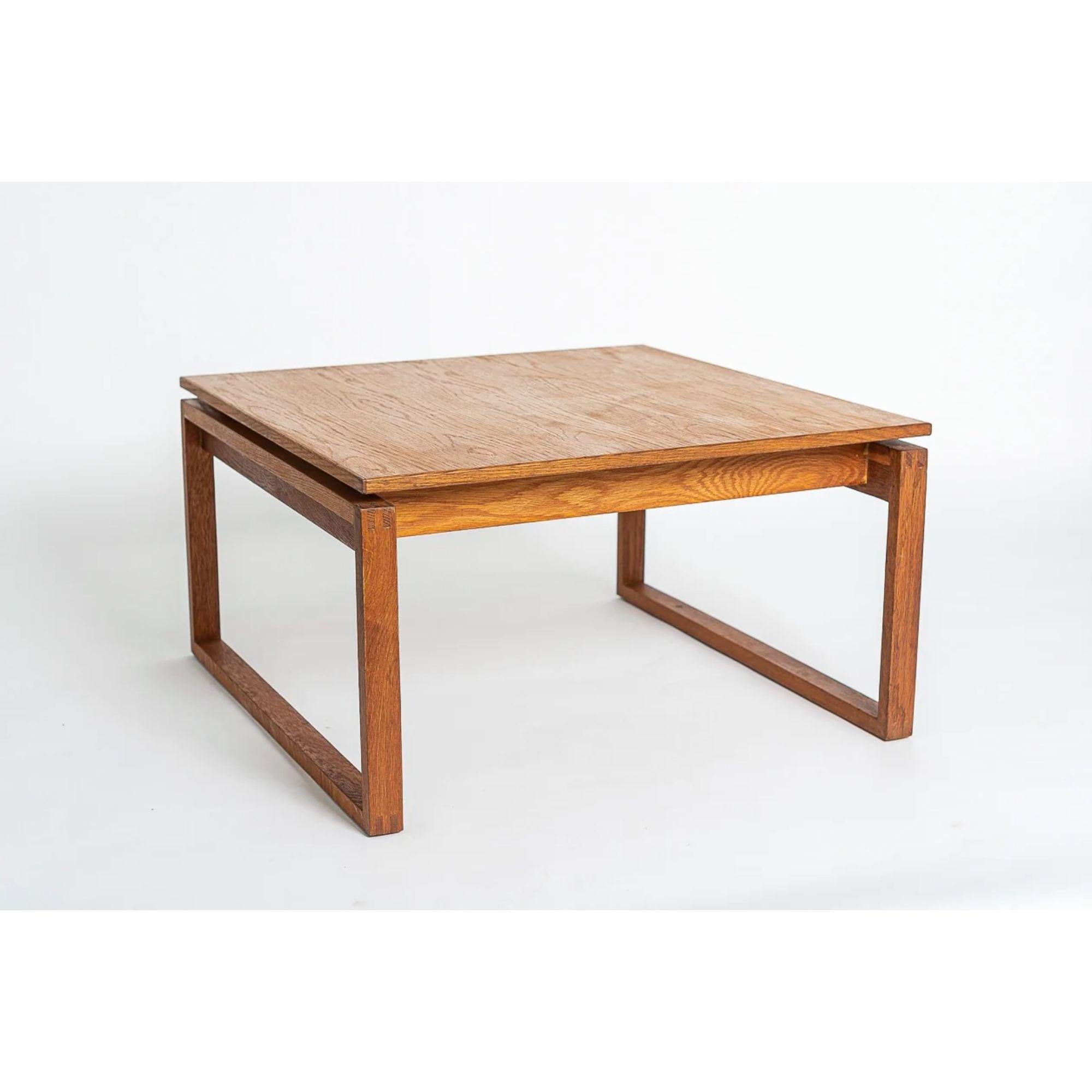 This vintage midcentury Jens Risom square wood coffee table circa 1960 has a Classic Danish modern design with clean, Minimalist, geometric lines. This rare Model 4074 square coffee table is solid, heavy and well-crafted. The unique design features