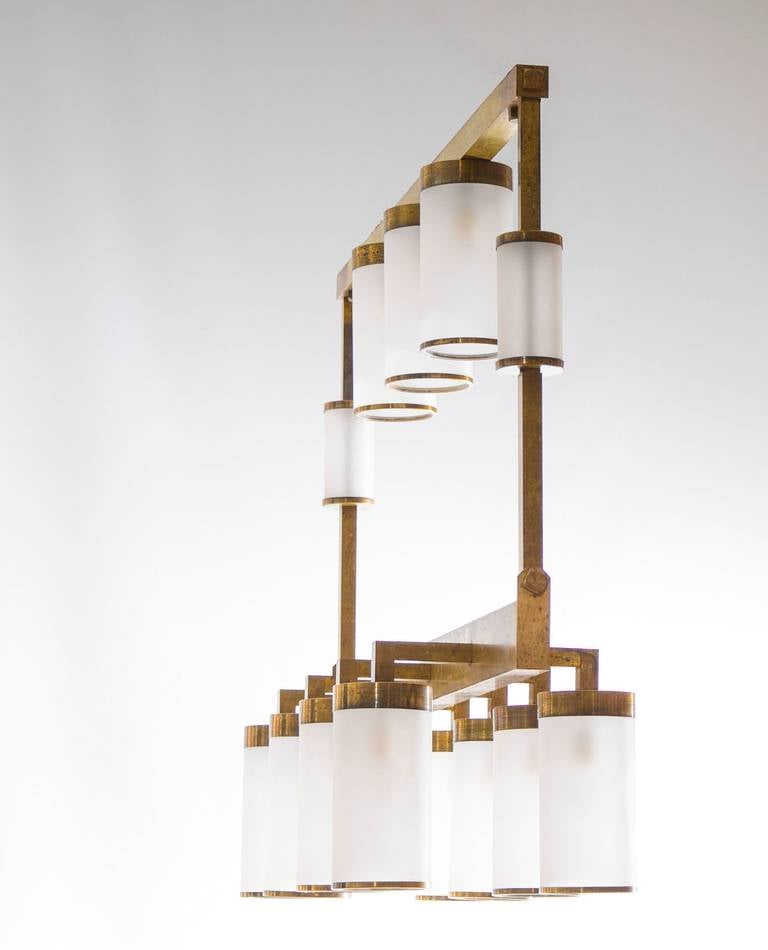 Mid-Century Brass Chandelier White Sandblasted Murano Glass cylinder Italy 1950s.
Entirely handcrafted in the 1950s in Murano, the Venetian island famous for its unrivaled blown glass tradition, this chandelier consists of an imposing rectangular