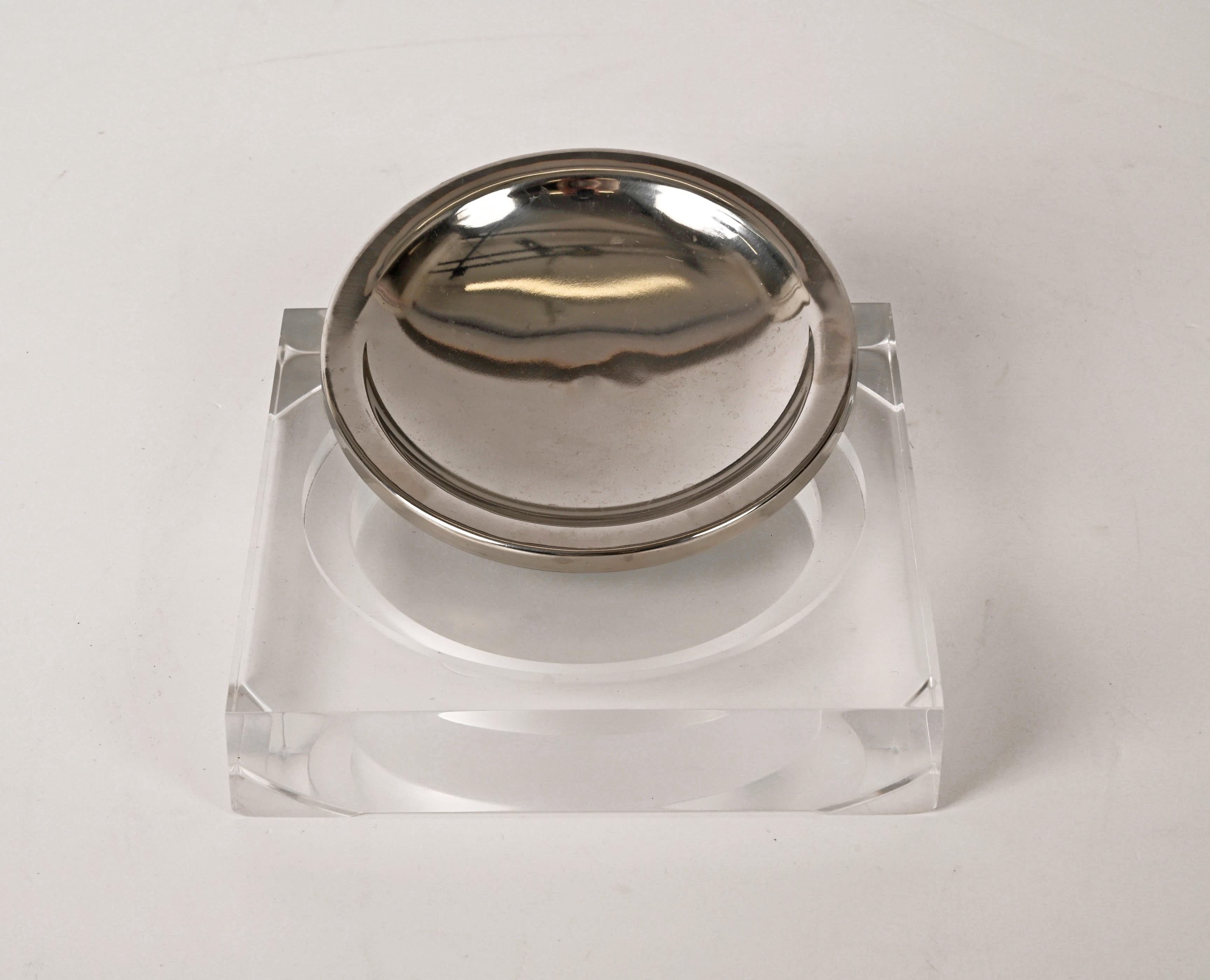 Stunning midcentury Lucite and chrome squared valet tray or ashtray. This wonderful item was produced in France in the style of Christian Dior in 1970.

The pocket emptier is lovely because of the beautiful straight lines and the chromed metal