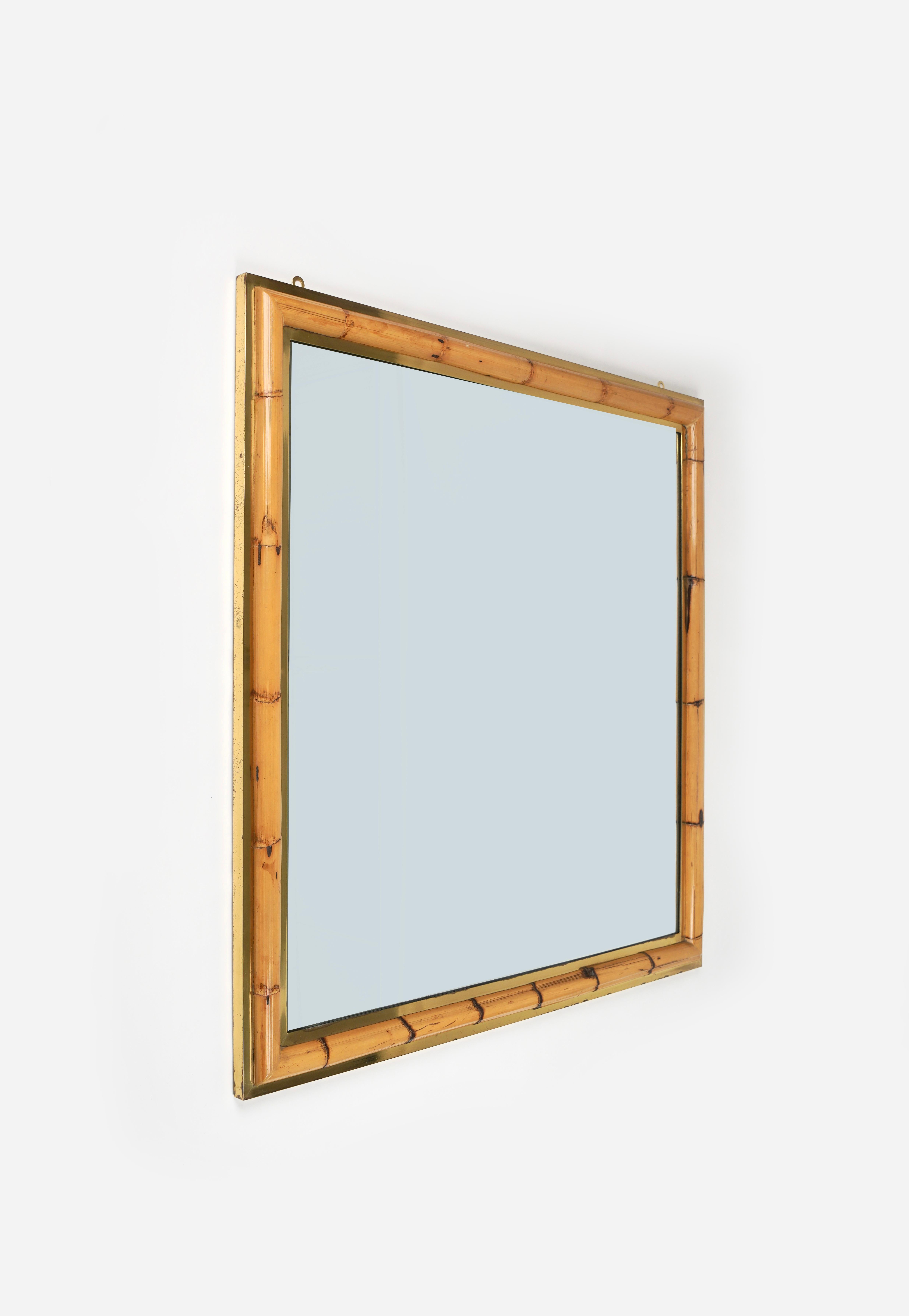 Gorgeous midcentury squared wall mirror in brass and bamboo in the style of Gabriella Crespi.

Made in Italy in the 1970s.