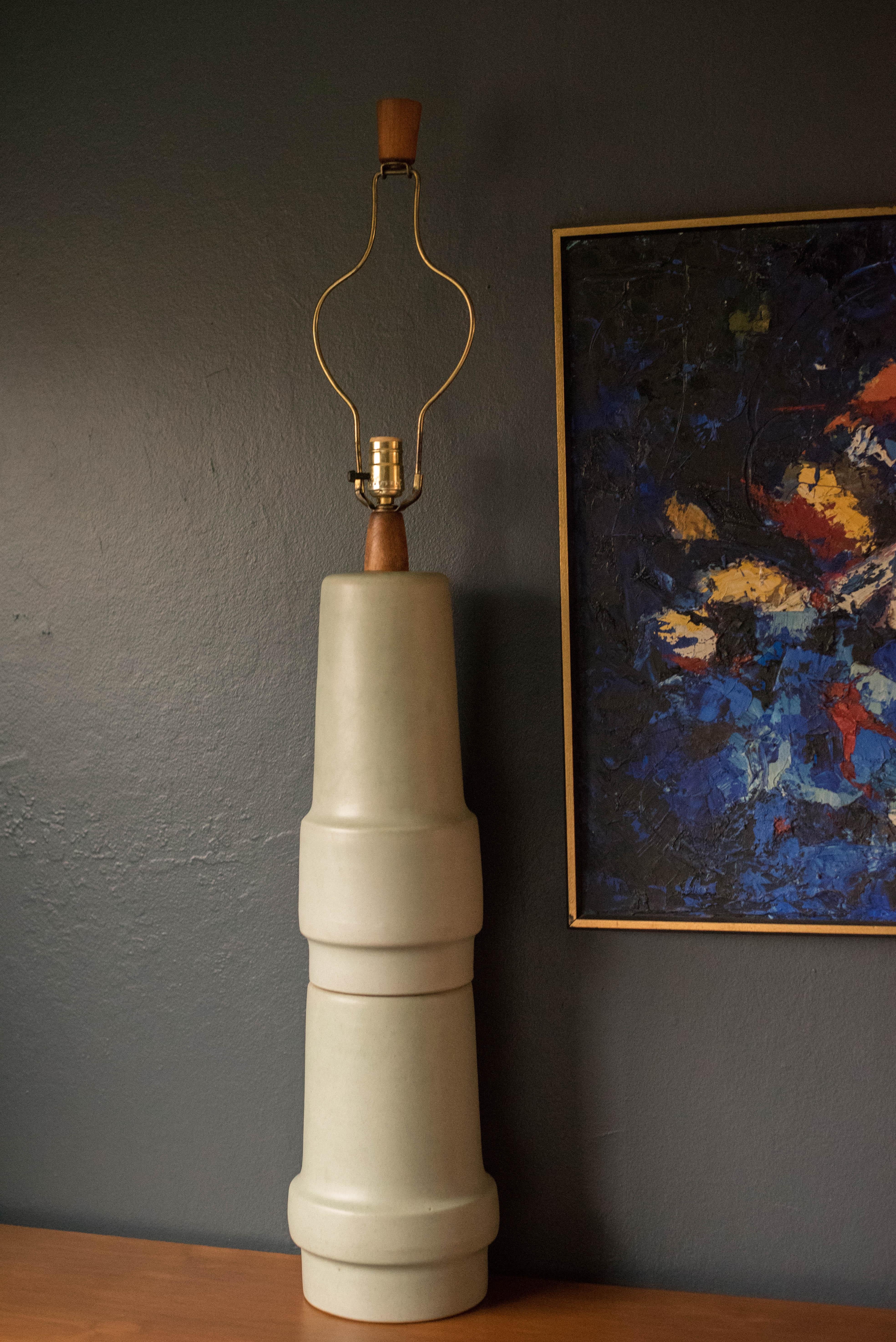 Mid Century ceramic and walnut lamp by Gordon and Jane Martz for Marshall Studios. This oversized lamp features a sculptural stacked form and includes a three way switch mechanism.

   

Offered by Mid Century Maddist