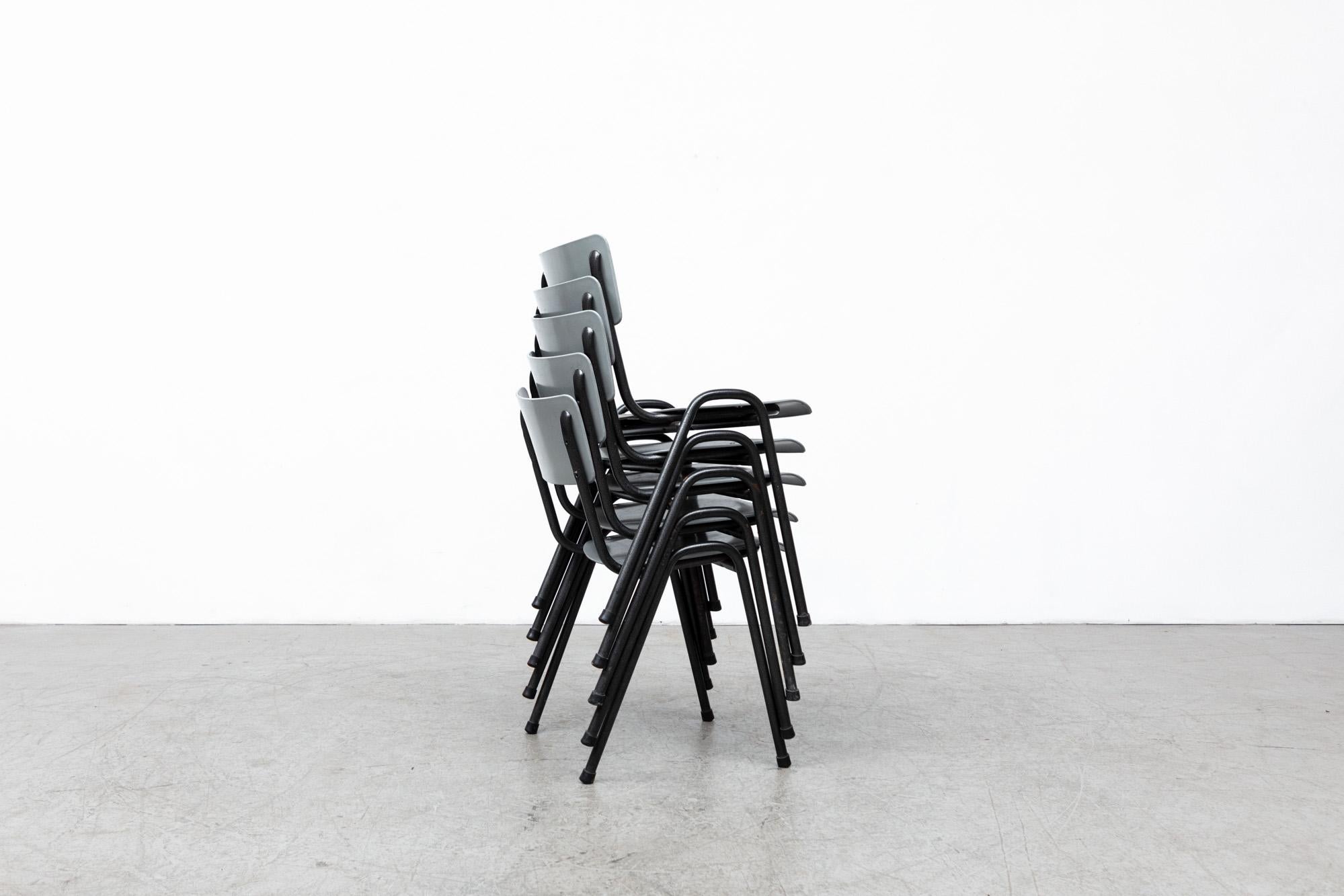 Mid-Century Stacking School or Restaurant Chairs with Grey Plastic Seating and Black Enameled Frame. In original condition with wear consistent with age and use. Listed individually.