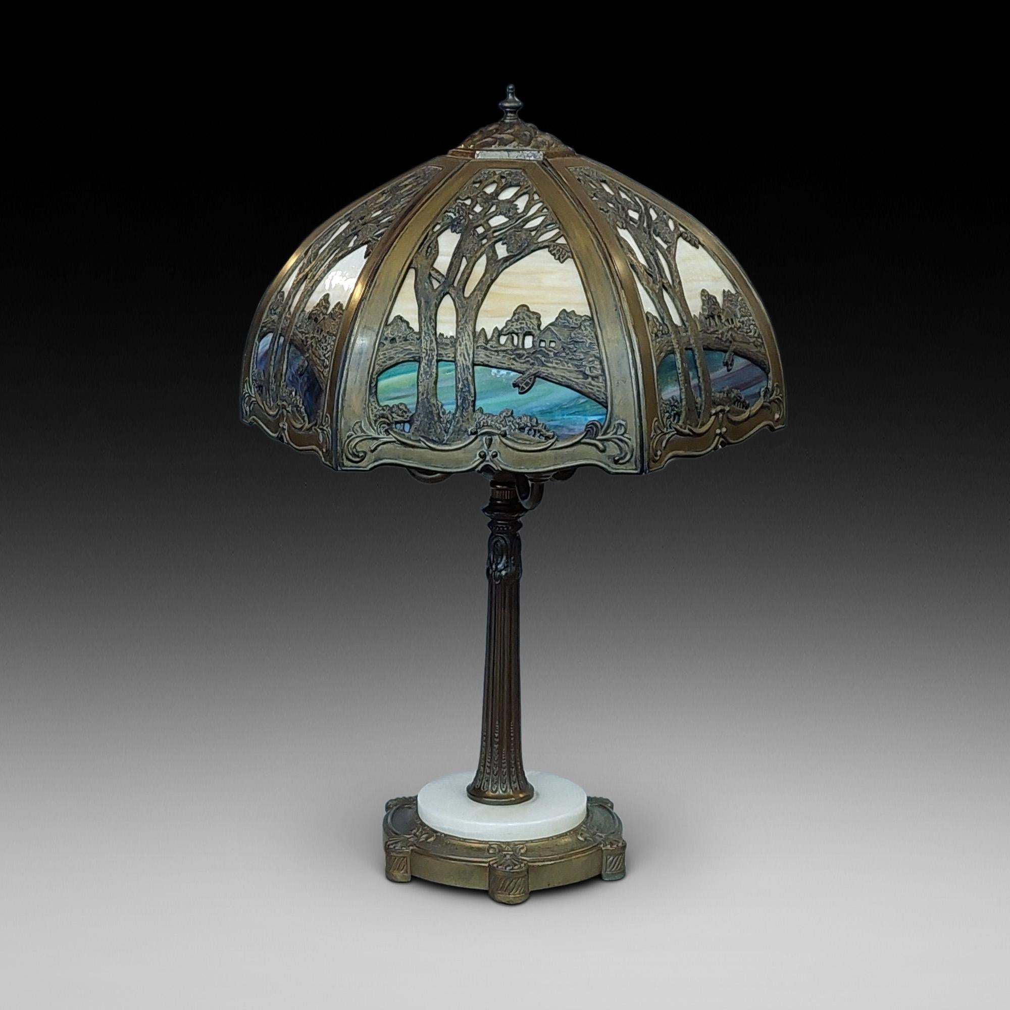 Mid Century Stained Glass Table Lamp, in Galle Art Nouveau Style, the shade worked with landscapes over a gilded spelter reeded column base with three lamps - ArtCraft - New York - founded 1955 - 19