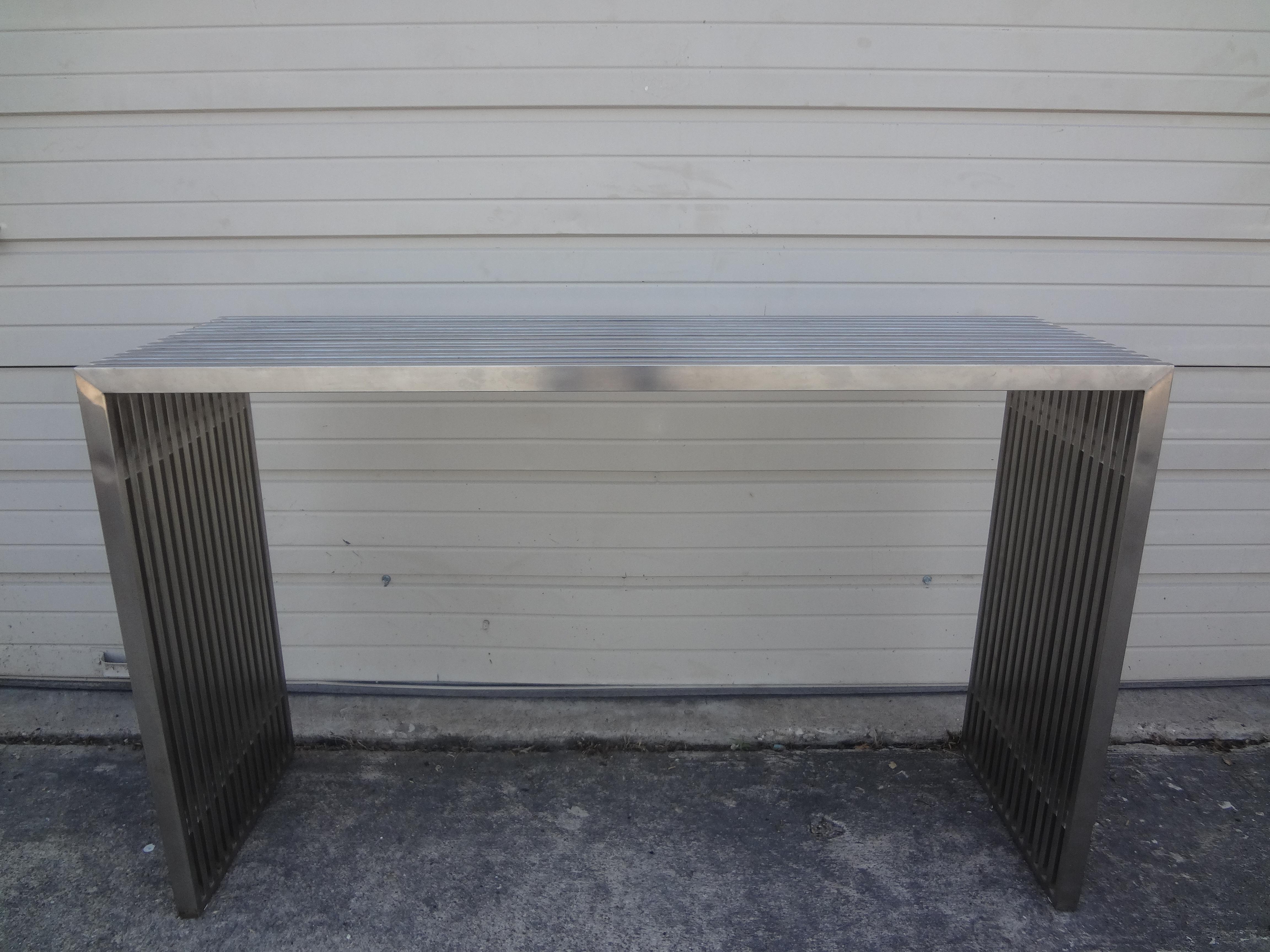 Midcentury stainless steel and acrylic console table. This handsome stainless and lucite console table or sofa table, possibly Italian can be used with or without a glass top.
This does not come with a glass top.