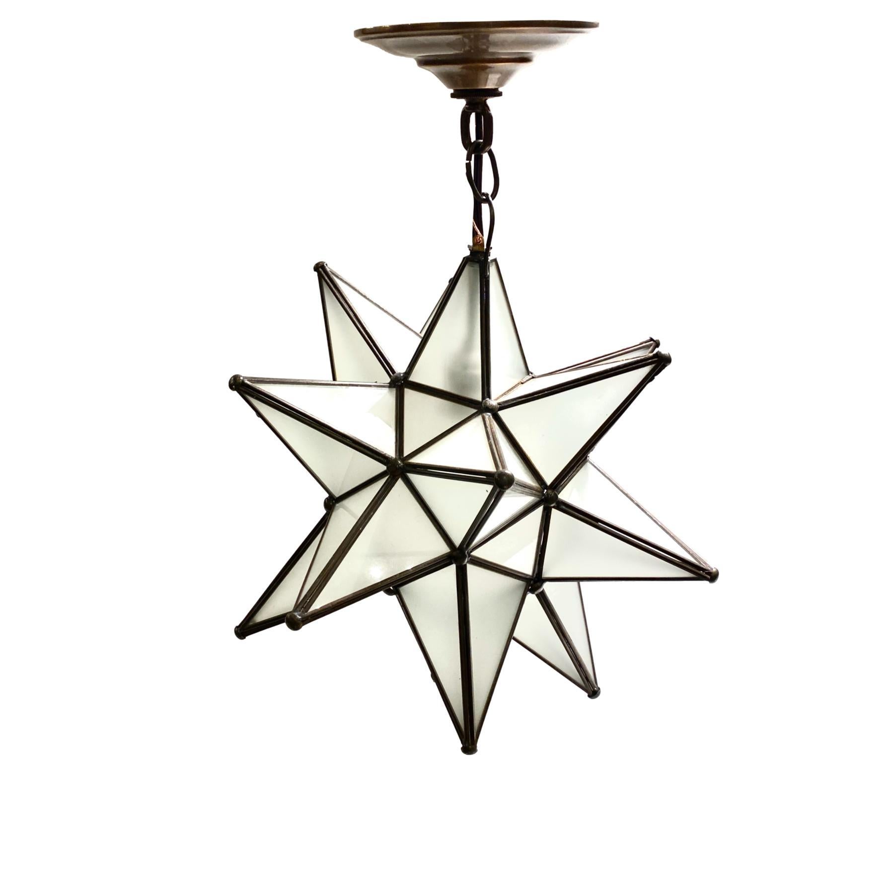 A pair of circa 1950's French star-shaped light fixture with interior light. Sold individually.

Measurements:
Drop: 19