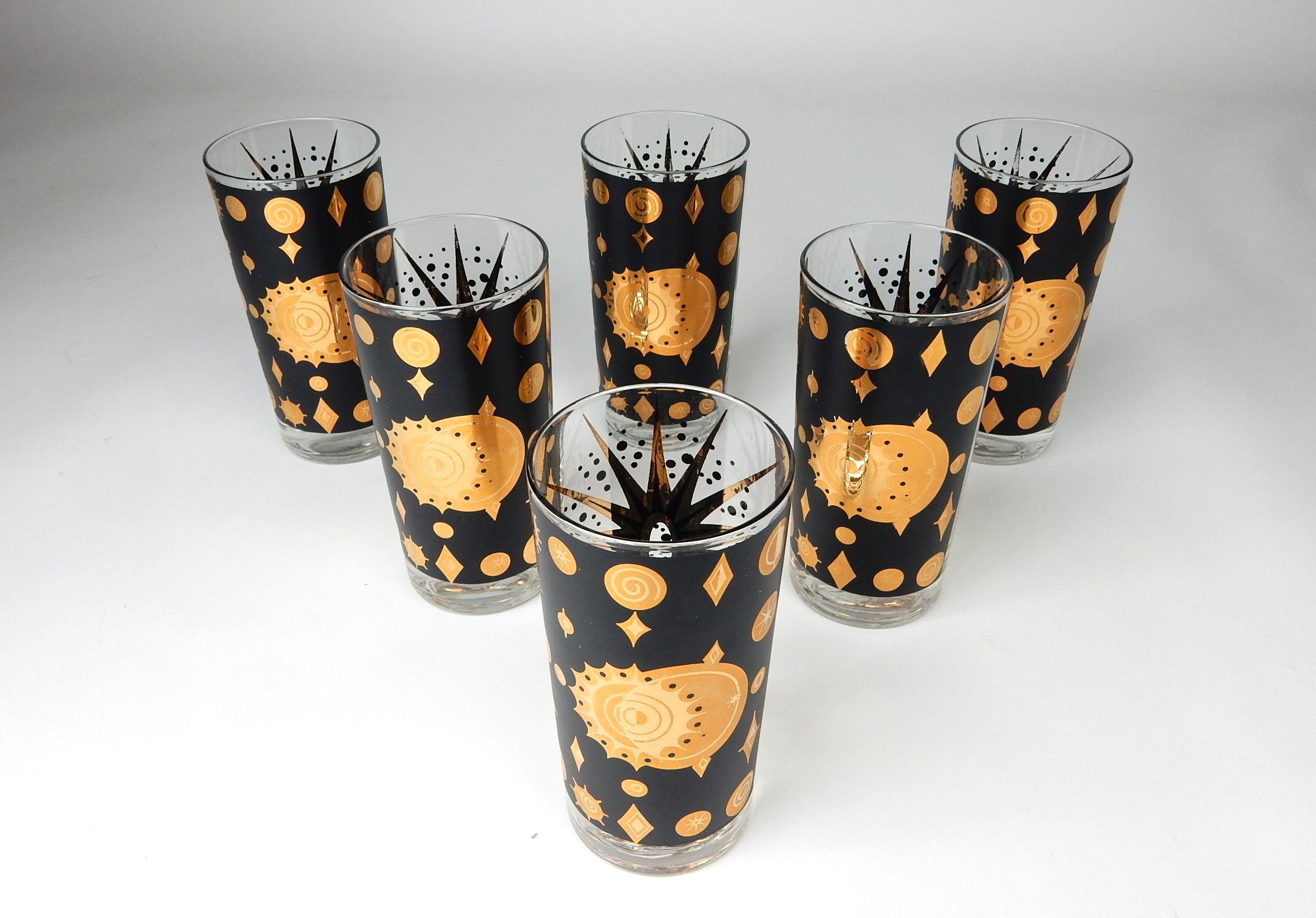 Spectacular set of hi-ball bar glasses by Fred Press.
Big golden star on one side and celestial gold planets of the other.
Set shows light use only.