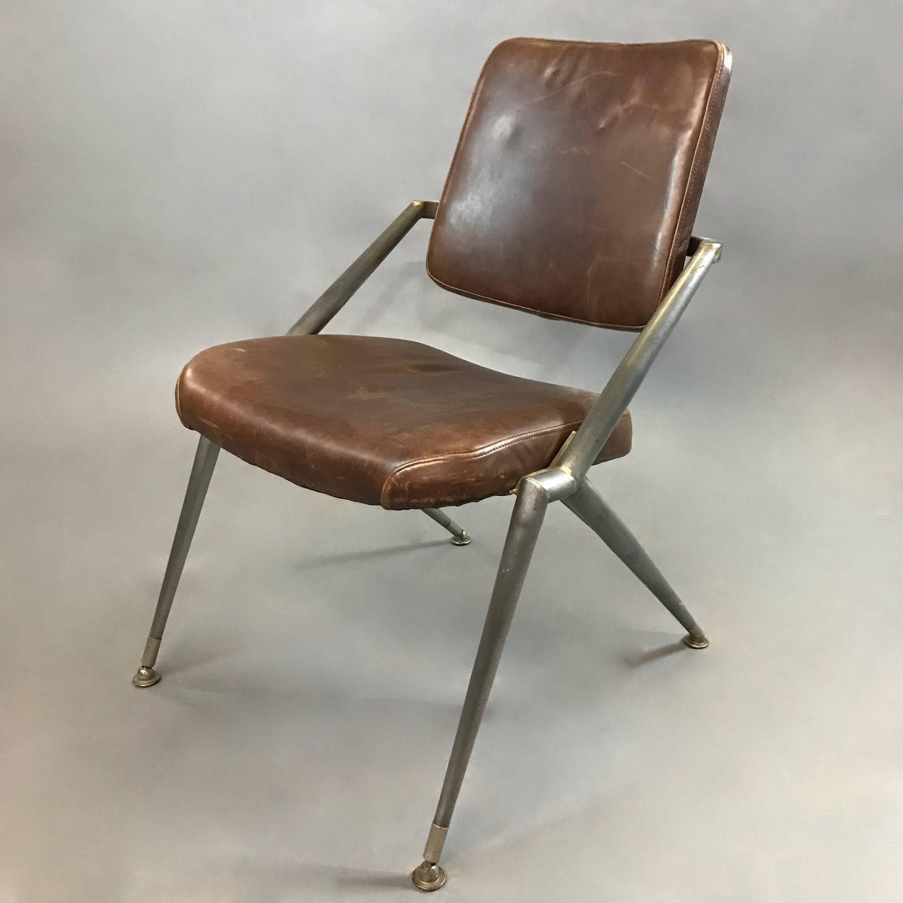 Prototype, Mid-Century Modern, office, desk chair by Cramer features a stylized steel frame with newly upholstered, luggage leather seat and back. This prototype is institutional midcentury at it's finest.
