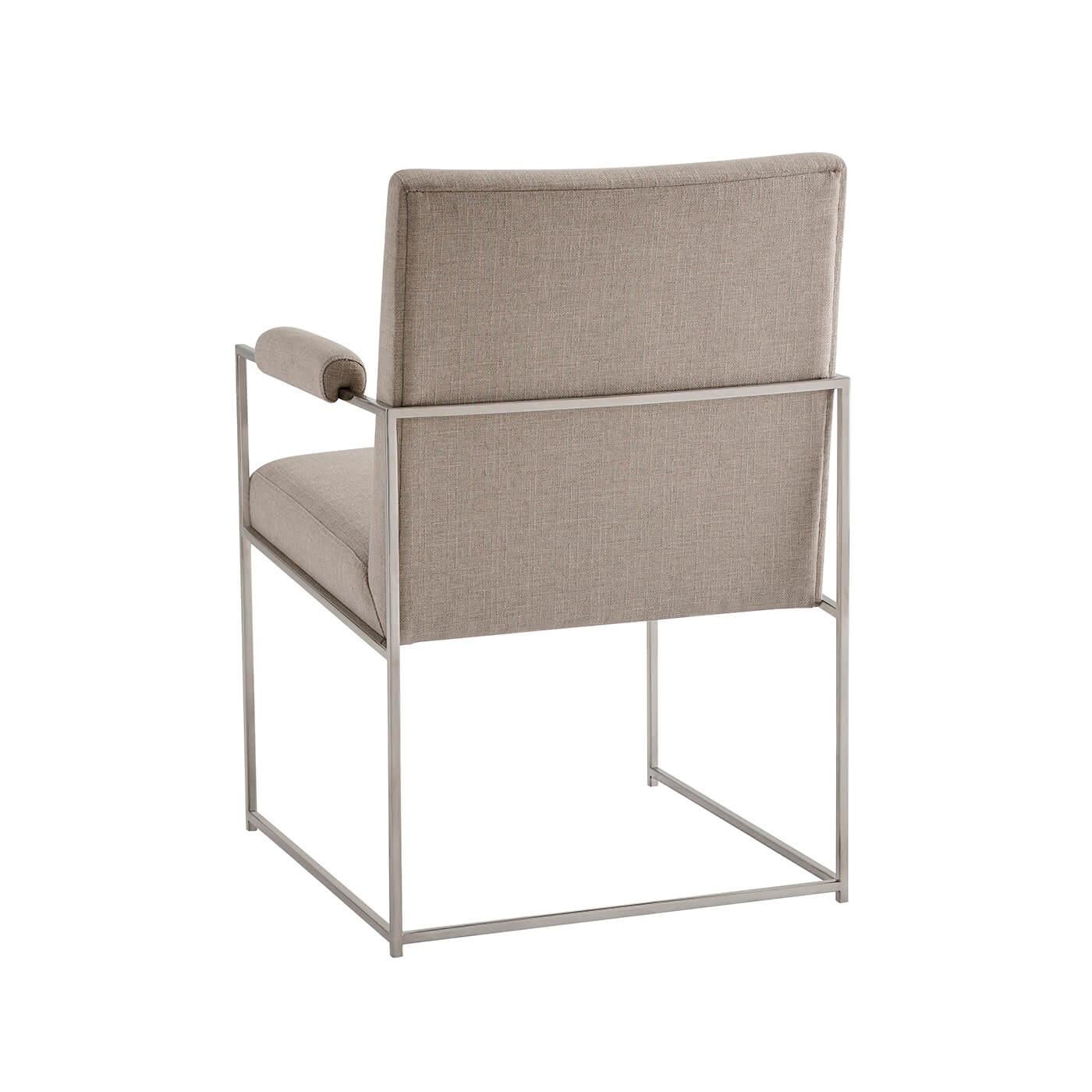 Midcentury steel frame dining armchair with a nickel finish steel frame, boxed upholstered back and seat, with angular polished nickel finish legs, joined by stretchers.

Dimensions: 24.25