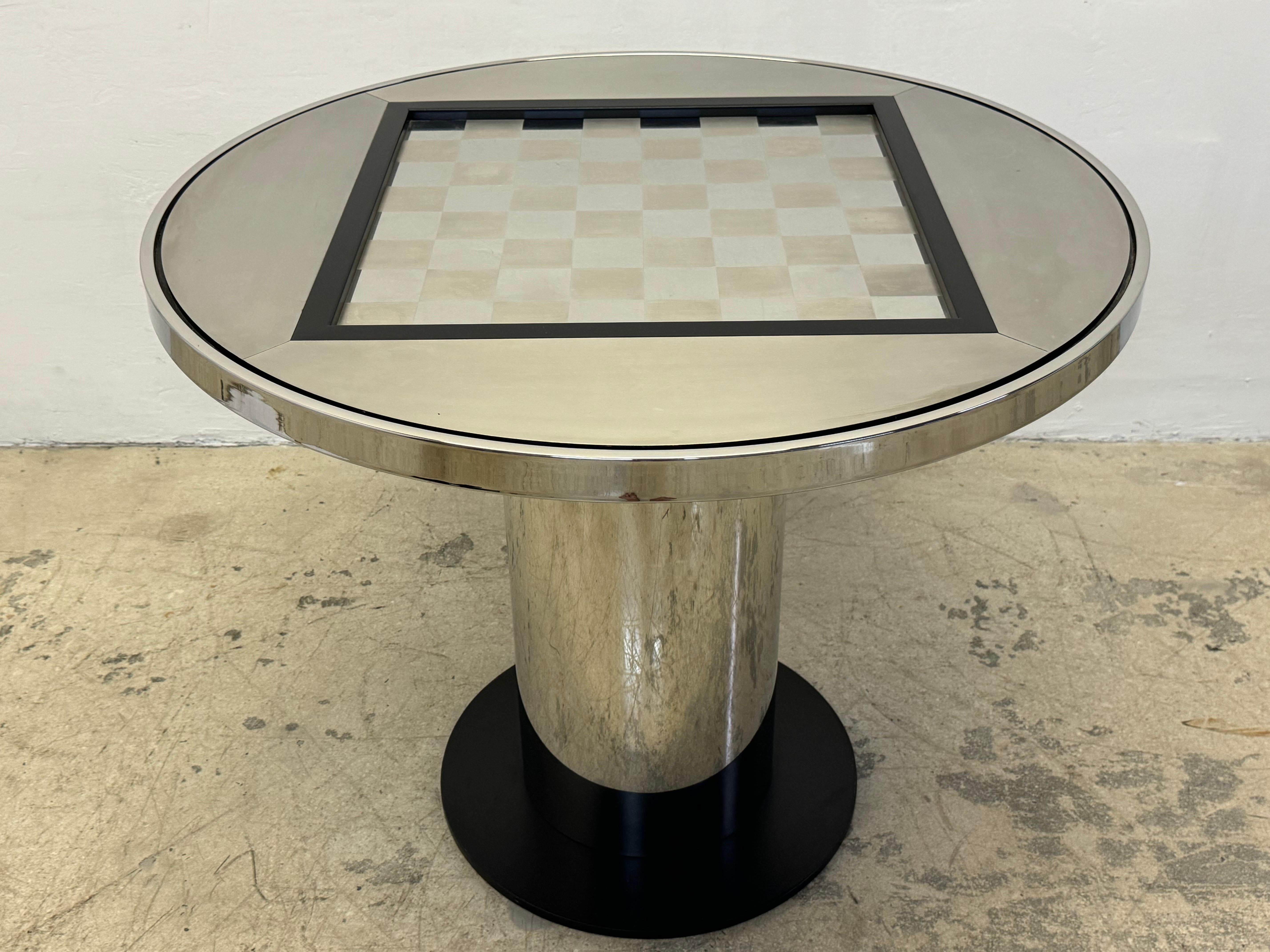 Sleek Mid-Century modern chess or checkers game table made completely of steel with varying finished including brushed, polished and anodized black.  Table is most probably by Design Institute America DIA but is also similar to pieces by Paul Evans