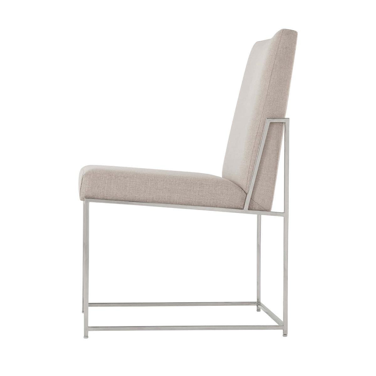 Mid century steel frame dining chair with a nickel finish steel frame, boxed upholstered back and seat, with angular polished nickel finish legs, joined by stretchers.

Dimensions: 22.5