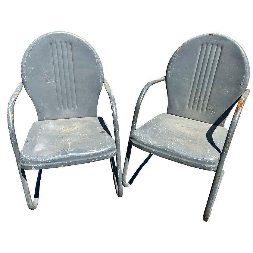 Steel Mid-century Springer Outdoor grey enamel Lounge Chair Set of Two. Each chair features a round tubular U-shaped base that rocks and forth when pushed back and forth. The chair features a round Streamline pressed steel seat back with a lined