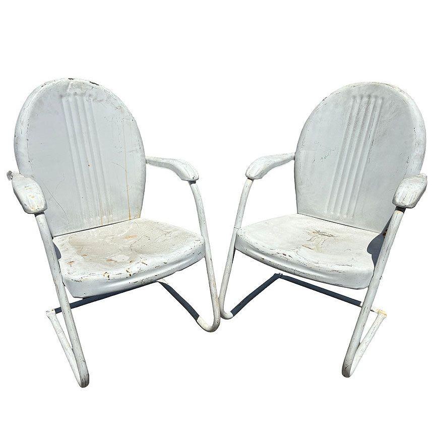 Steel Mid-century Springer Outdoor grey enamel Lounge Chair Set of Two. Each chair features a round tubular U-shaped base that rocks and forth when pushed back and forth. The chair features a Streamline round pressed steel seat back with a lined
