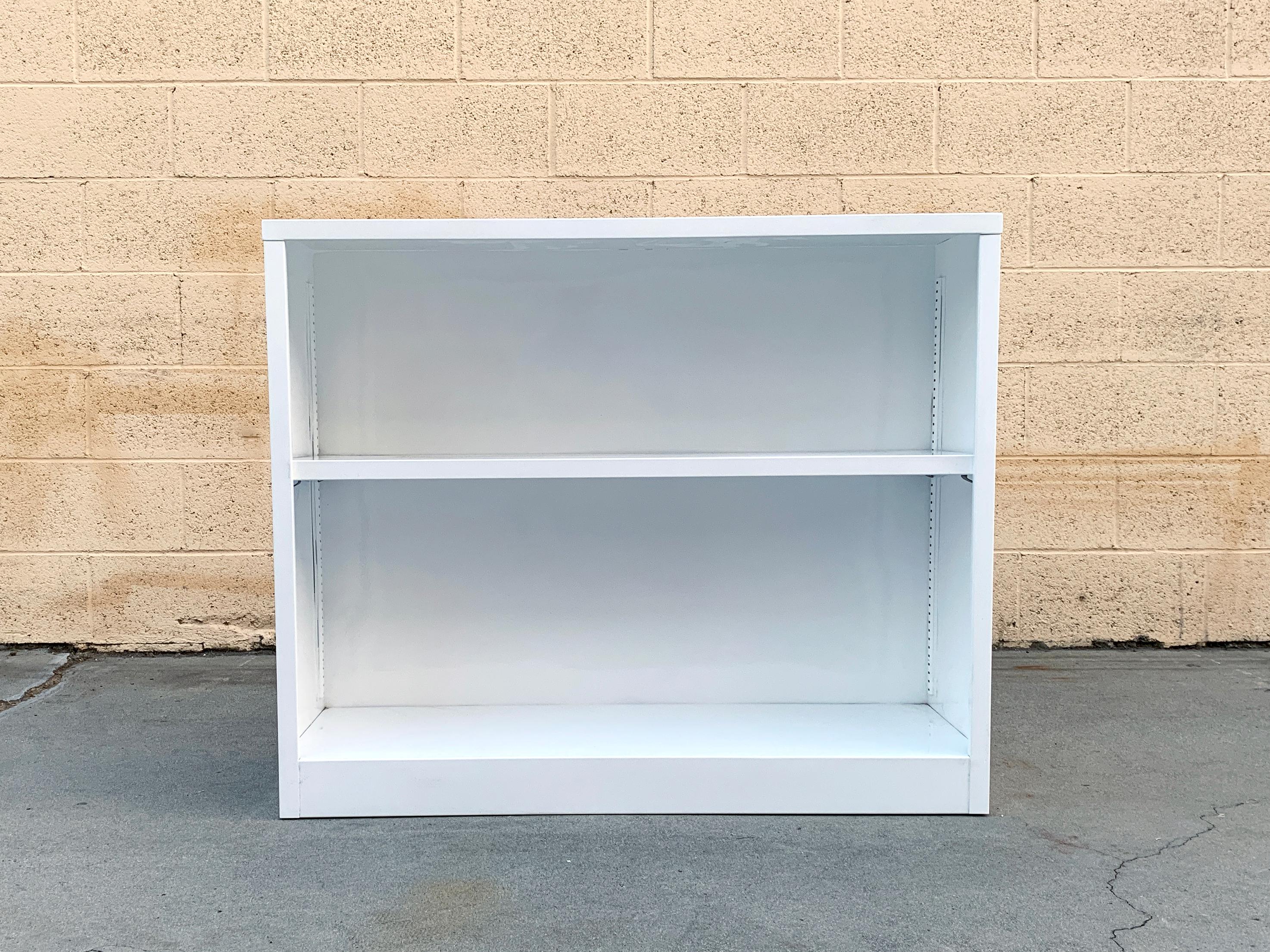 This midcentury tanker bookcase is an uncommon, petit size, ideal for home offices or smaller spaces. Mix and match with all your favorite McDowell Craig and AllSteel accessories!

Newly refinished in gloss white with minimal wear to steel.