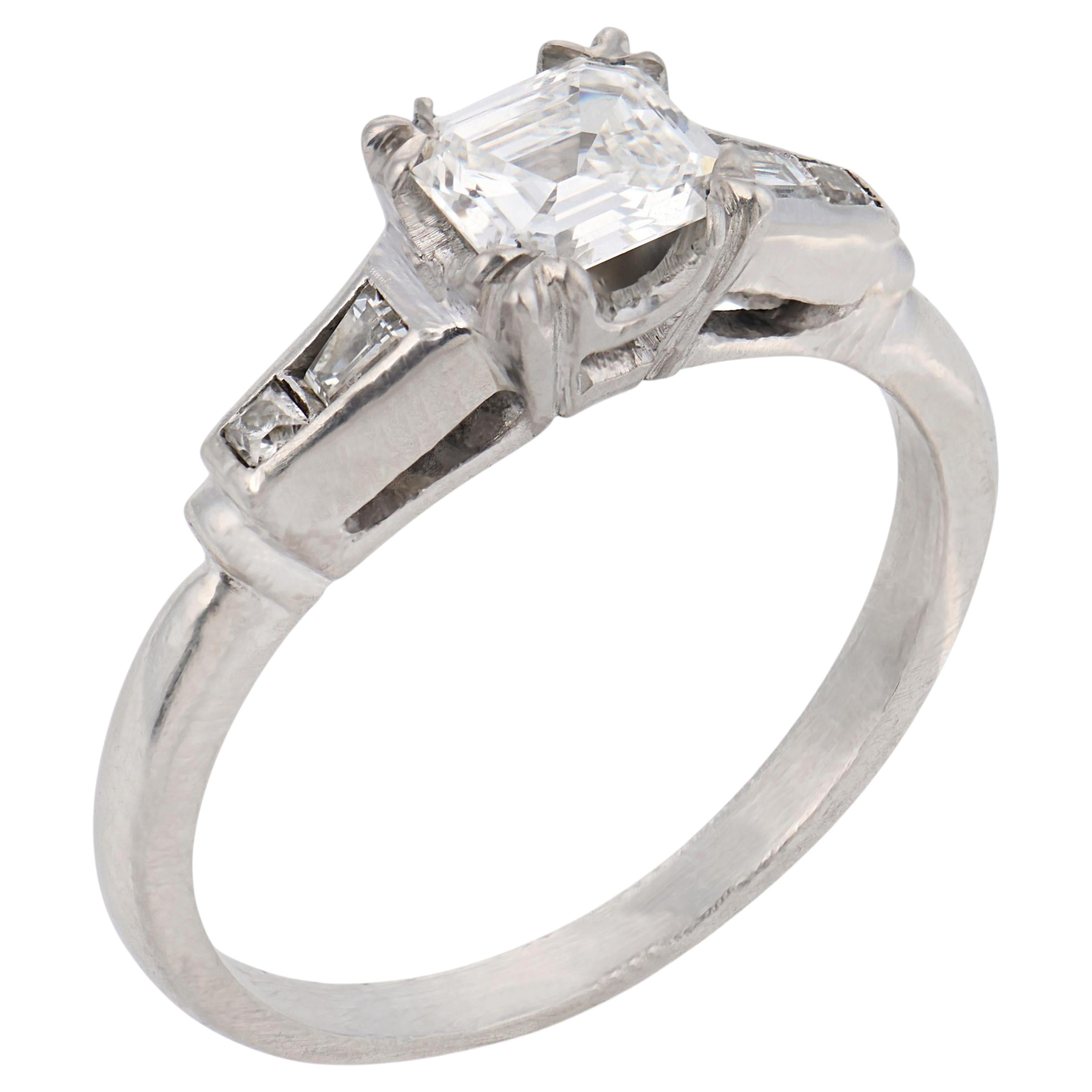 Mid Century step cut diamond platinum engagement ring