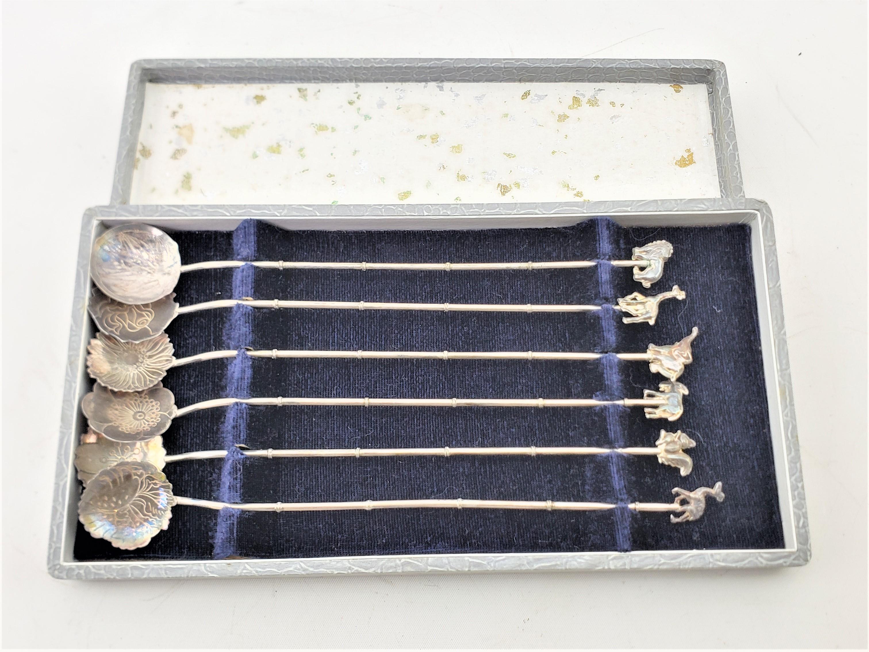 This boxed set of six cocktail or ice tea spoons are unsigned, but presumed to have originated from Germany and date to approximately 1960 and done in the period Mid-Century Modern style. The spoons are composed of a combination of sterling and .900