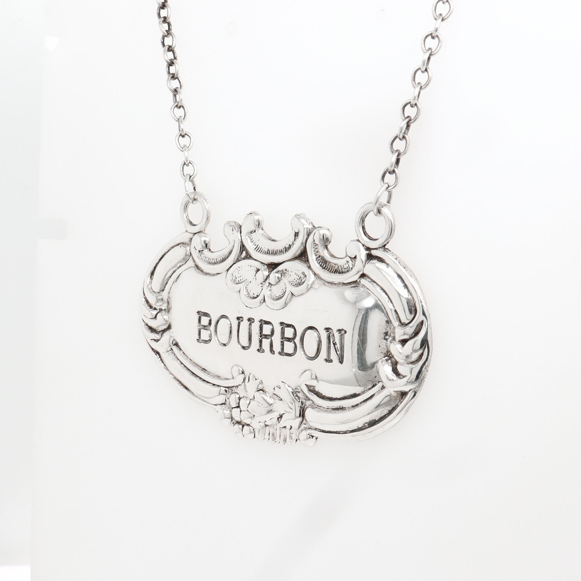 A fine vintage silver Bourbon whiskey decanter or liquor label.

In sterling silver.

The silver label hangs on a chain and reads: BOURBON

Marked to the reverse.

Simply a great vintage Bourbon label!

Date: 
Mid-20th Century

Overall Condition:
It