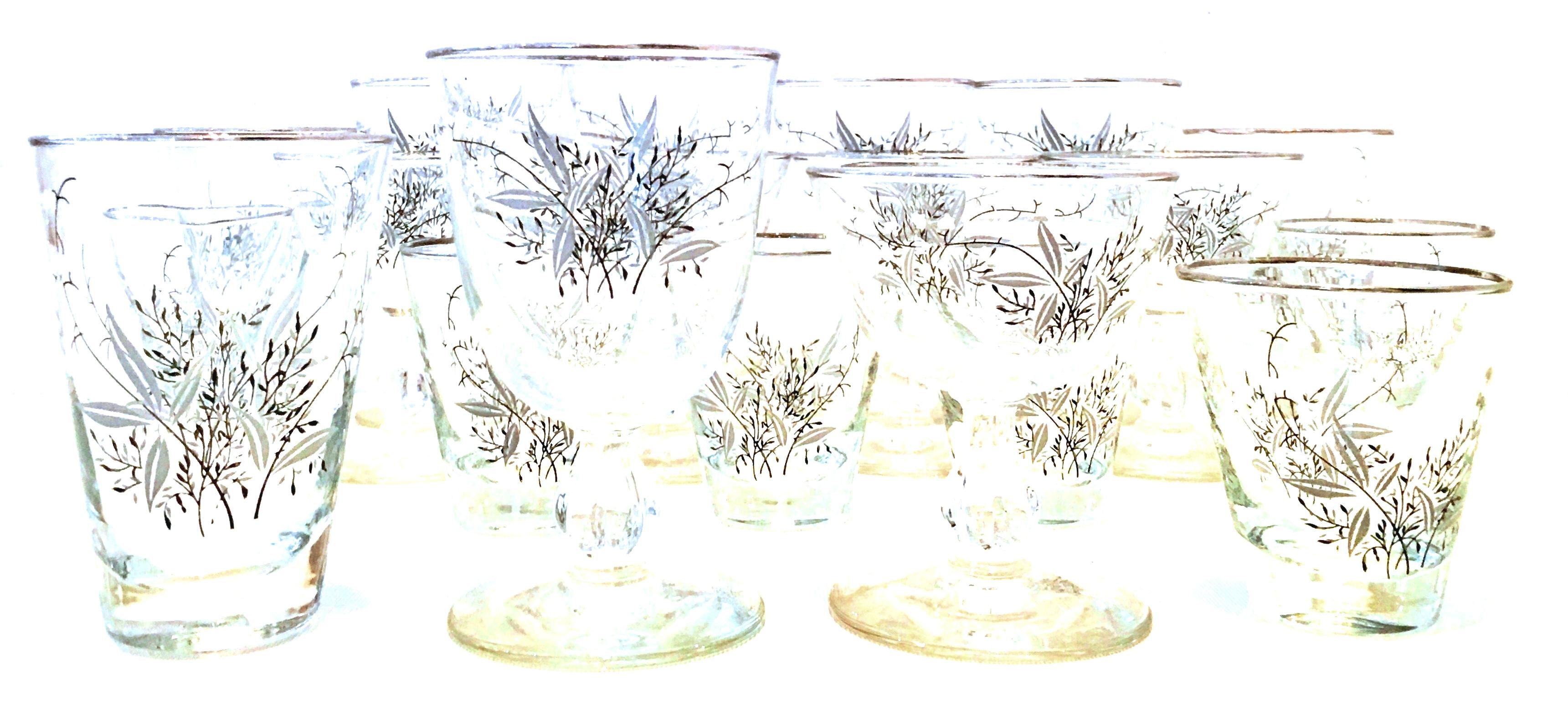 Mid-Century Modern sterling silver and embossed floral motif blown glass drinks set of 19 pieces. The embossed and printed pattern features a sterling silver rim with black, white and grey floral printed motif. Set includes, six cocktail glasses,