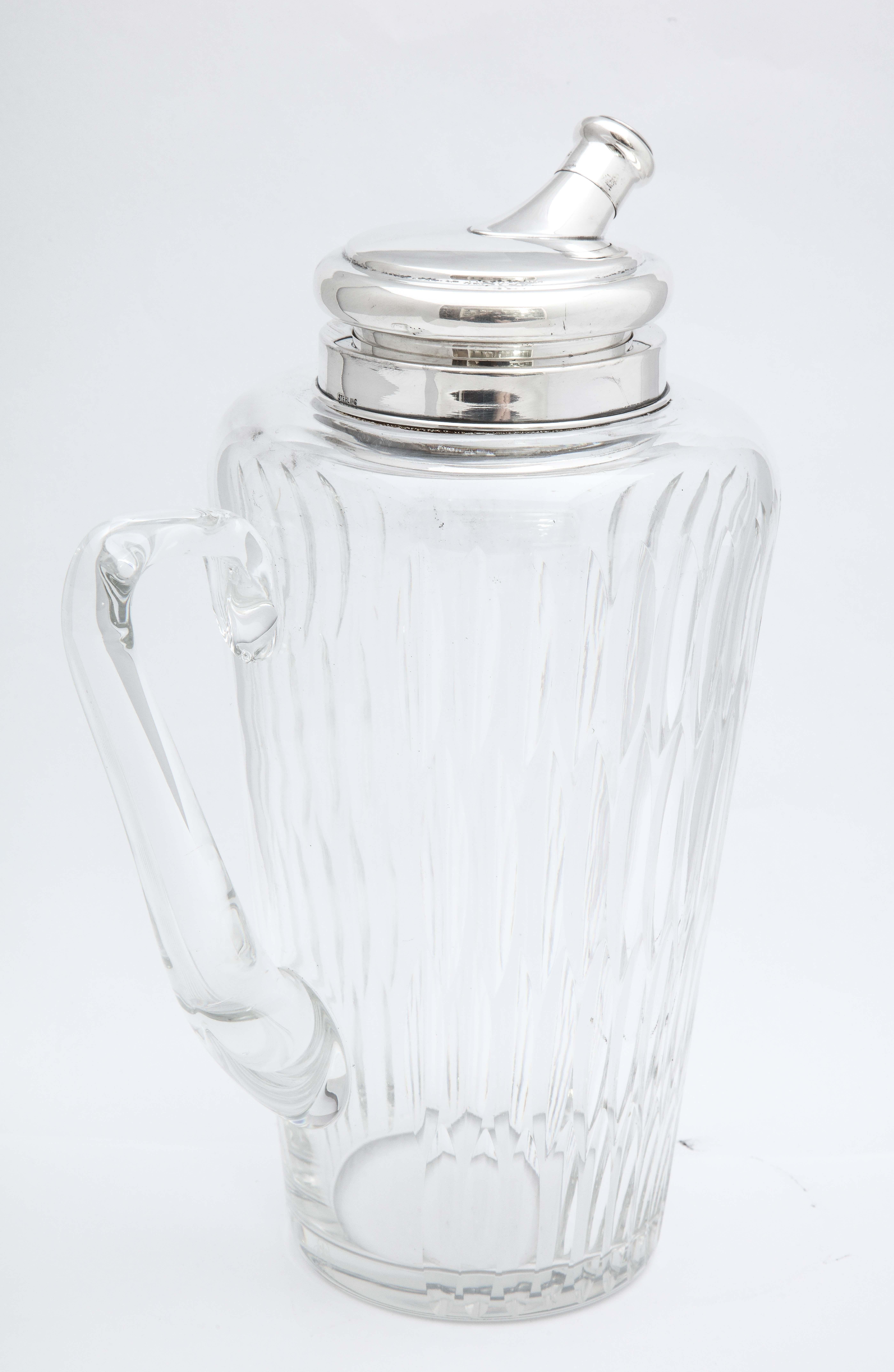 Mid-century, sterling silver-mounted glass cocktail shaker, New York, Ca. 1950's T.C. Hawkes and Co. - makers. Glass is signed on the base with the Hawkes logo. Measures 11 1/4 inches high x 5 inches diameter at widest point x 7 inches wide from