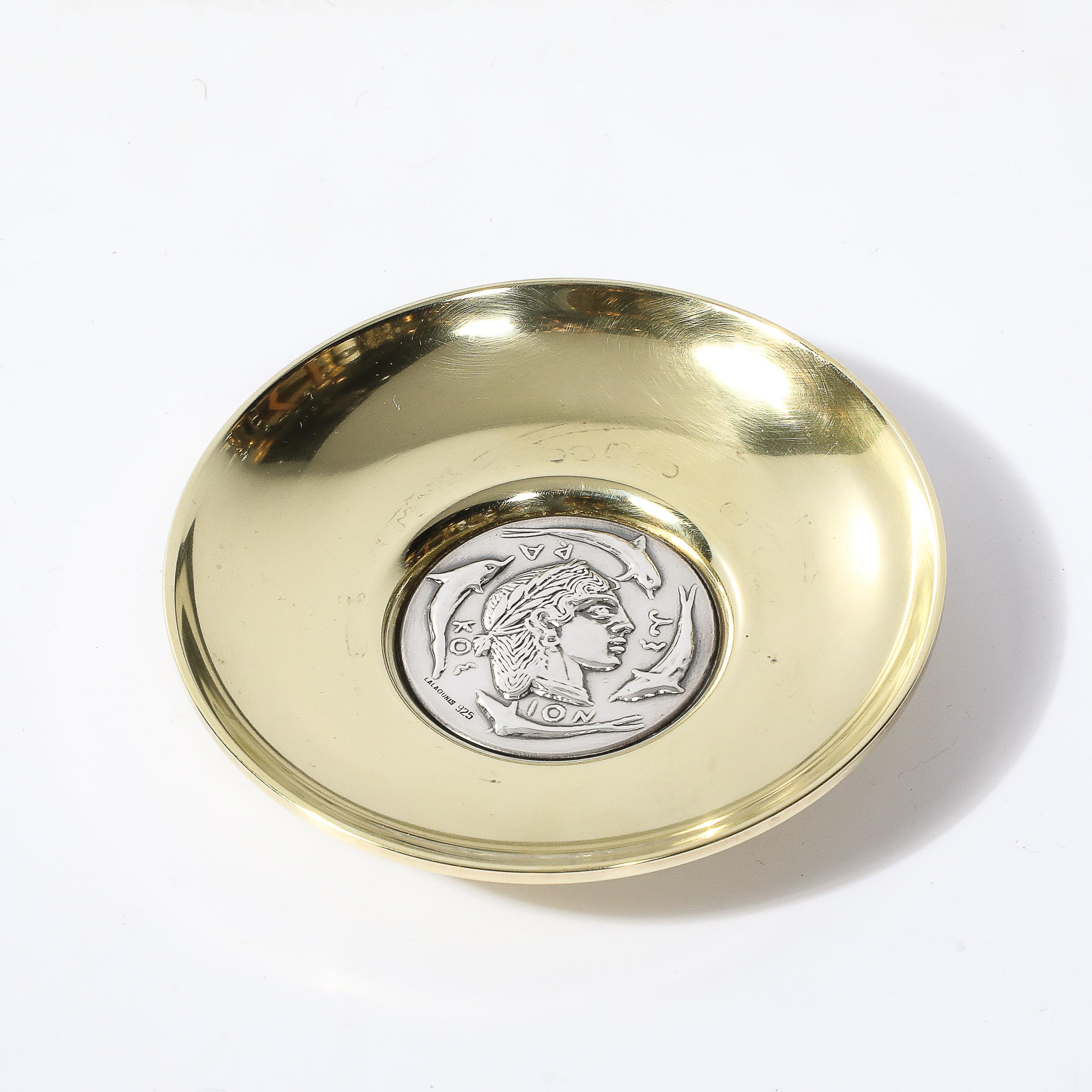 This Mid-Century Modernist sterling silver and polished brass tray, created by Lalaounis in Greece circa 1950, is a stunning piece that beautifully exemplifies the artistry and innovation of its era. Renowned for crafting exquisite jewelry and