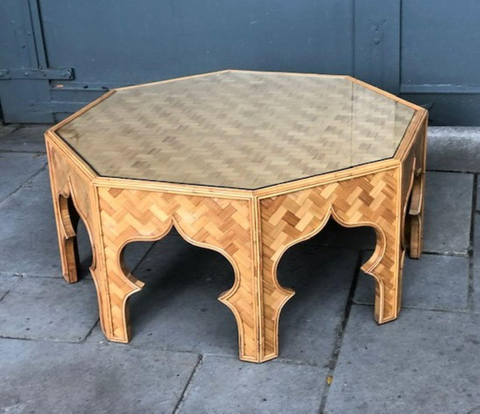 Mid century stick rattan & bamboo coffee table, Italian, 1970s

Magnificent mid-century octagonal stick rattan coffee table. 
Fantastic Moorish inspired coffee table, beautiful detailed stick rattan framework, sides and top covered in bamboo