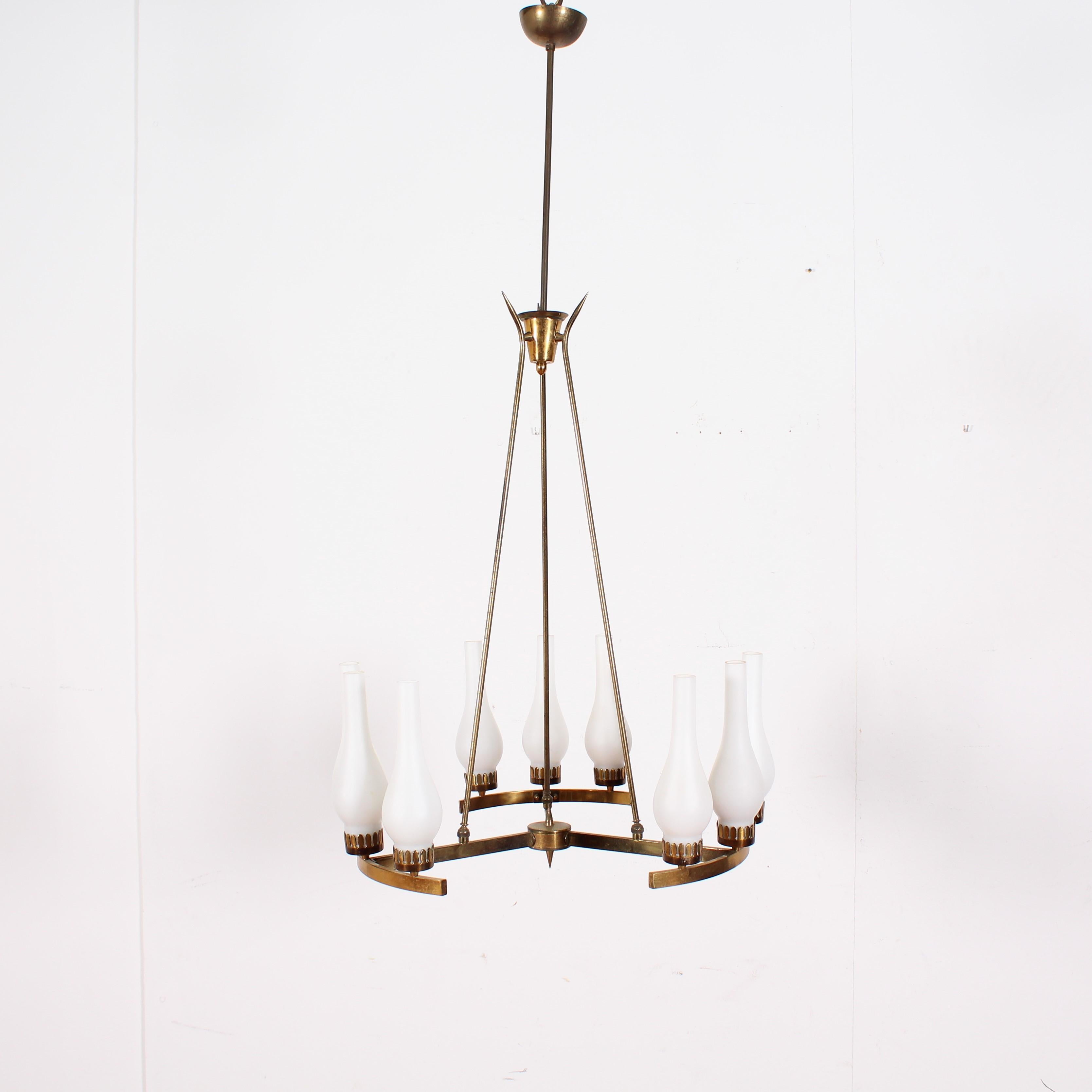 Elegant gilt brass chandelier with nine opal glass lampshades, in the style of Stilnovo, 1960s, Italy.
Wear according to age and use.
   