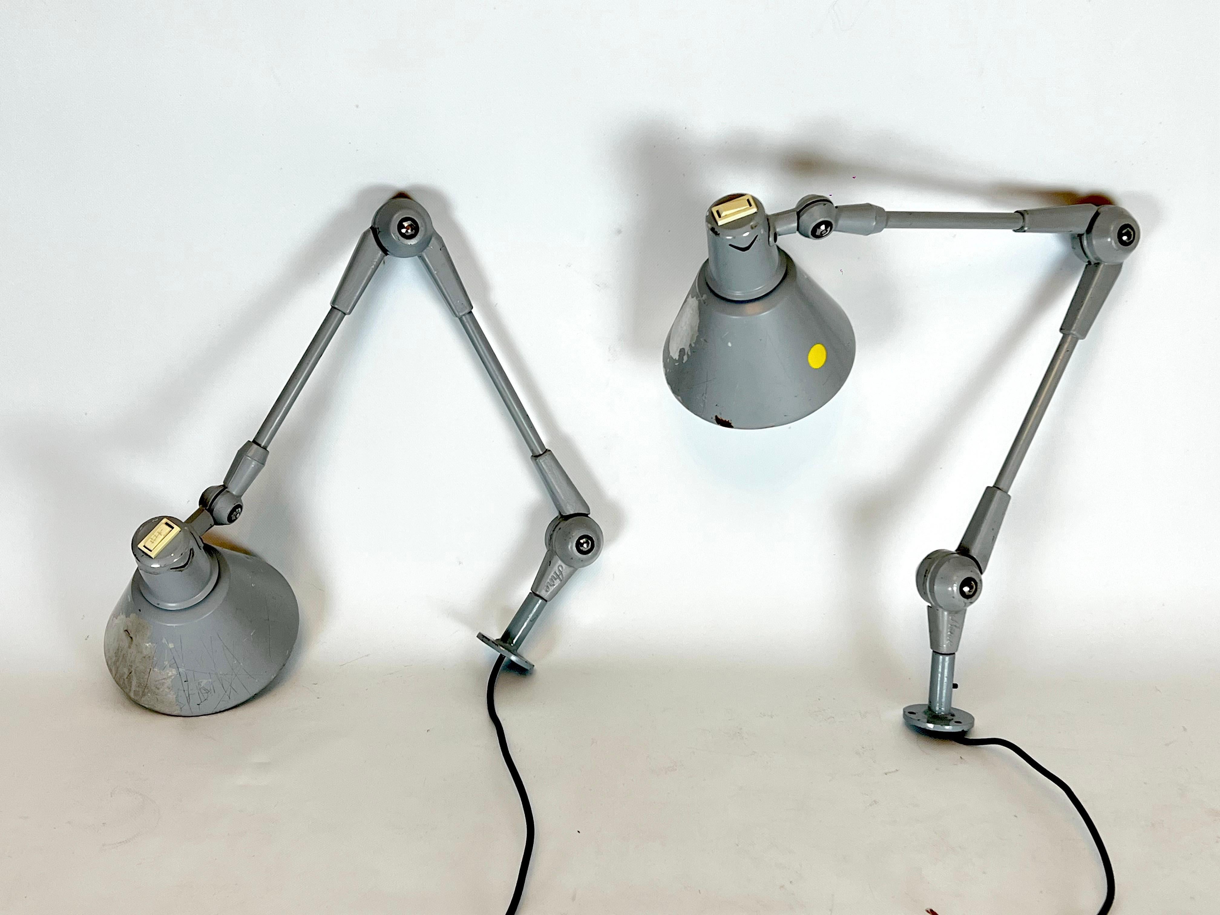 Set of two wall lamps model Aure by Stilnovo. Poor vintage condition with trace of age and use. Lack of lacquer and some dents on the diffusors. Full working with EU standard, adaptable on demand for USA standard.
