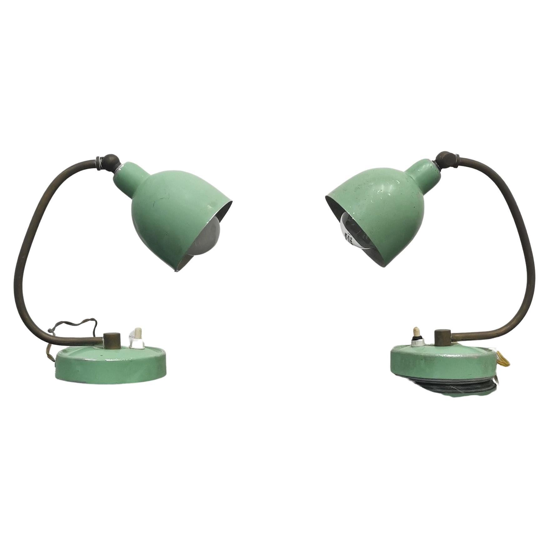 Pair of delightful adjustable table or desk lamps in light green lacquered metal, with rod in brass rod.
On / off button on the base. Attributed to Stilux Milan, 1950s, Italy.
Wear consistent with age and use.
