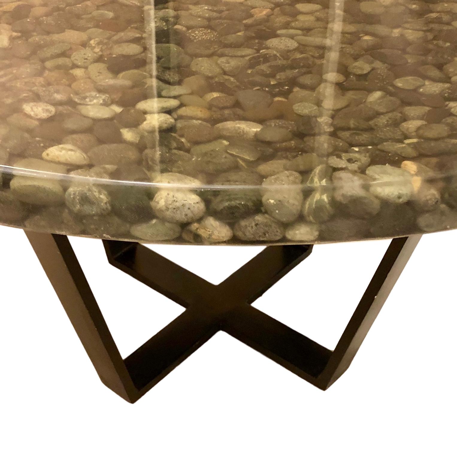 A circa 1960s Italian stone and resin dining table with iron base.

Measurements:
Height 30.5