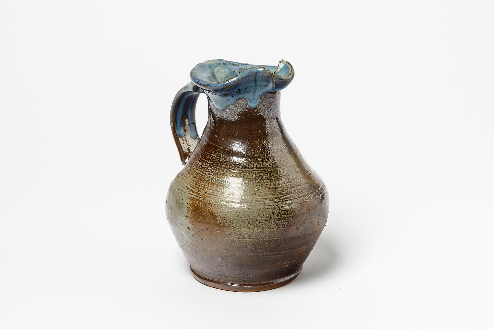 Jean Linard, (1931-2010)

Mid-20th century stoneware ceramic pitcher by Jean Linard 

Elegant blue ceramic glaze color on a brown ceramic pitcher

Realised circa 1970 

Signed at the base LINARD

Original perfect conditions

Measures: Height 17cm,