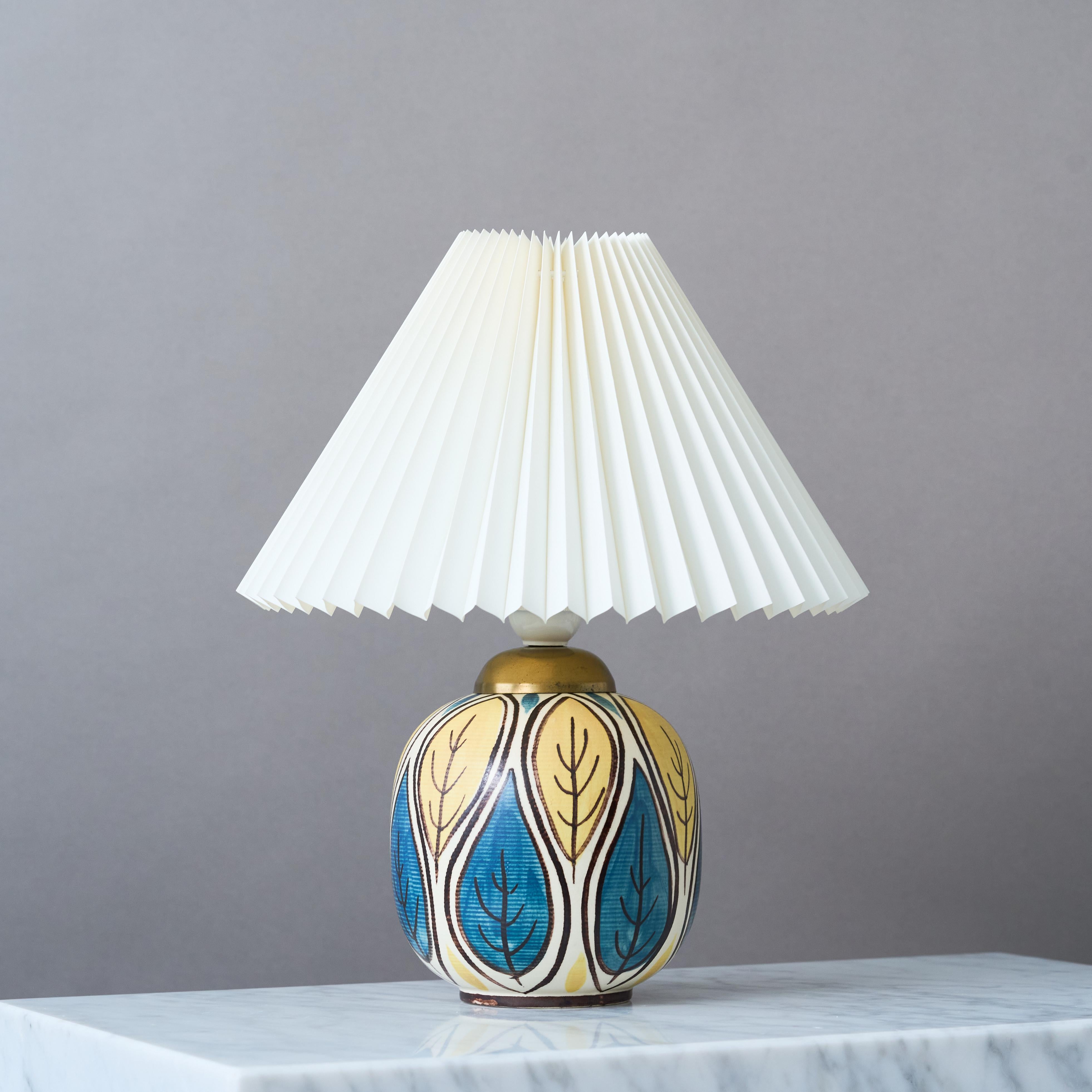 A beautiful mid-century stoneware table lamp with amazing decor.
Made by Hertha Bengtson for Rörstrand, Sweden, 1950s.

Great original condition. 
Signed 'Bengtson' and makers mark 'R'.

Sold without lampshade.

Dimensions of the lamp (without the