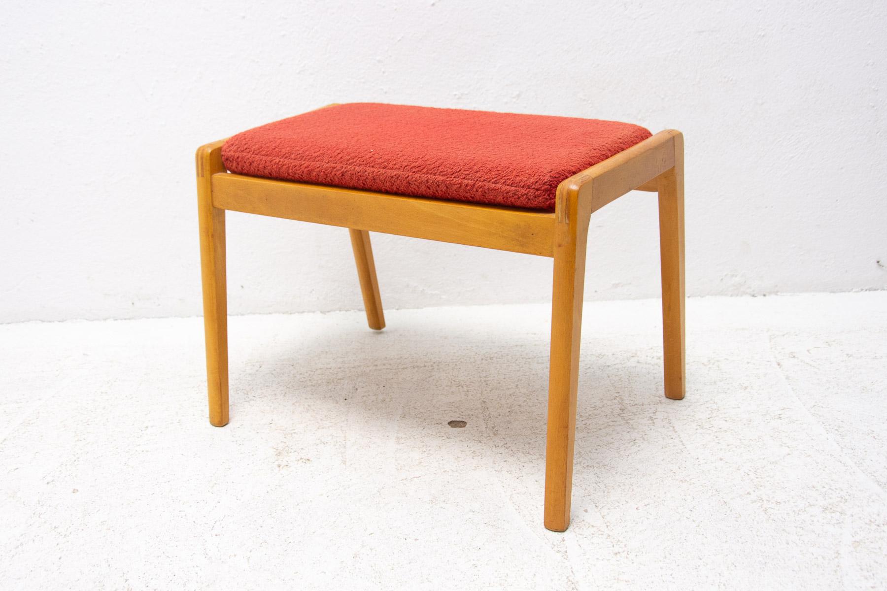 This stool / footrest was made in the former Czechoslovakia in the 1960's.

Features an upholstered removable seat, the structure is made of beech wood. In very good original condition, shows signs of age and using.

Measures: height: 39