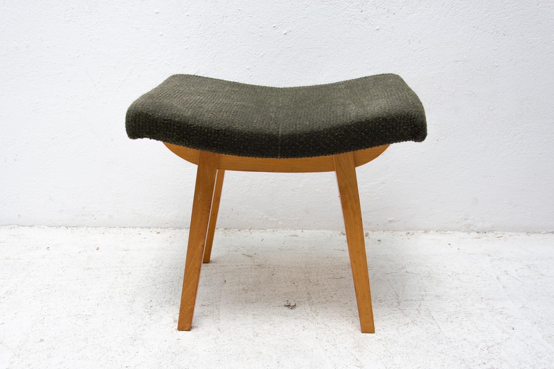 This stool/footrest was made by Západoslovenské nábytkárské Závody in the former Czechoslovakia in 1970. Features an upholstered seats and structure is made of beech wood. In very good original condition, bears some signs of age and using.
 