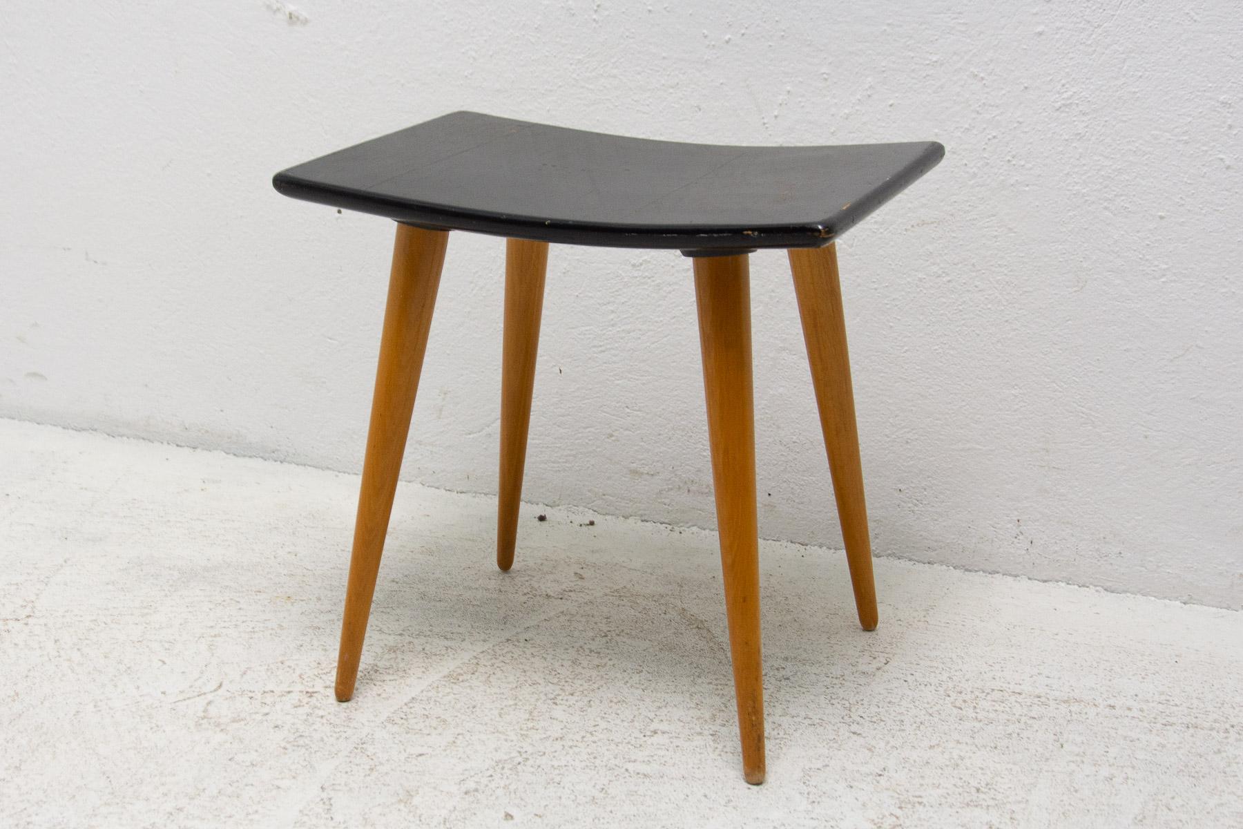 This stool/footrest was made by Západoslovenské nábytkárské Závody in the former Czechoslovakia in the 1970´s. It features plastic seat and the structure is made of beech wood. In good Vintage condition.

Measures: Height: 41 cm

Width: 41